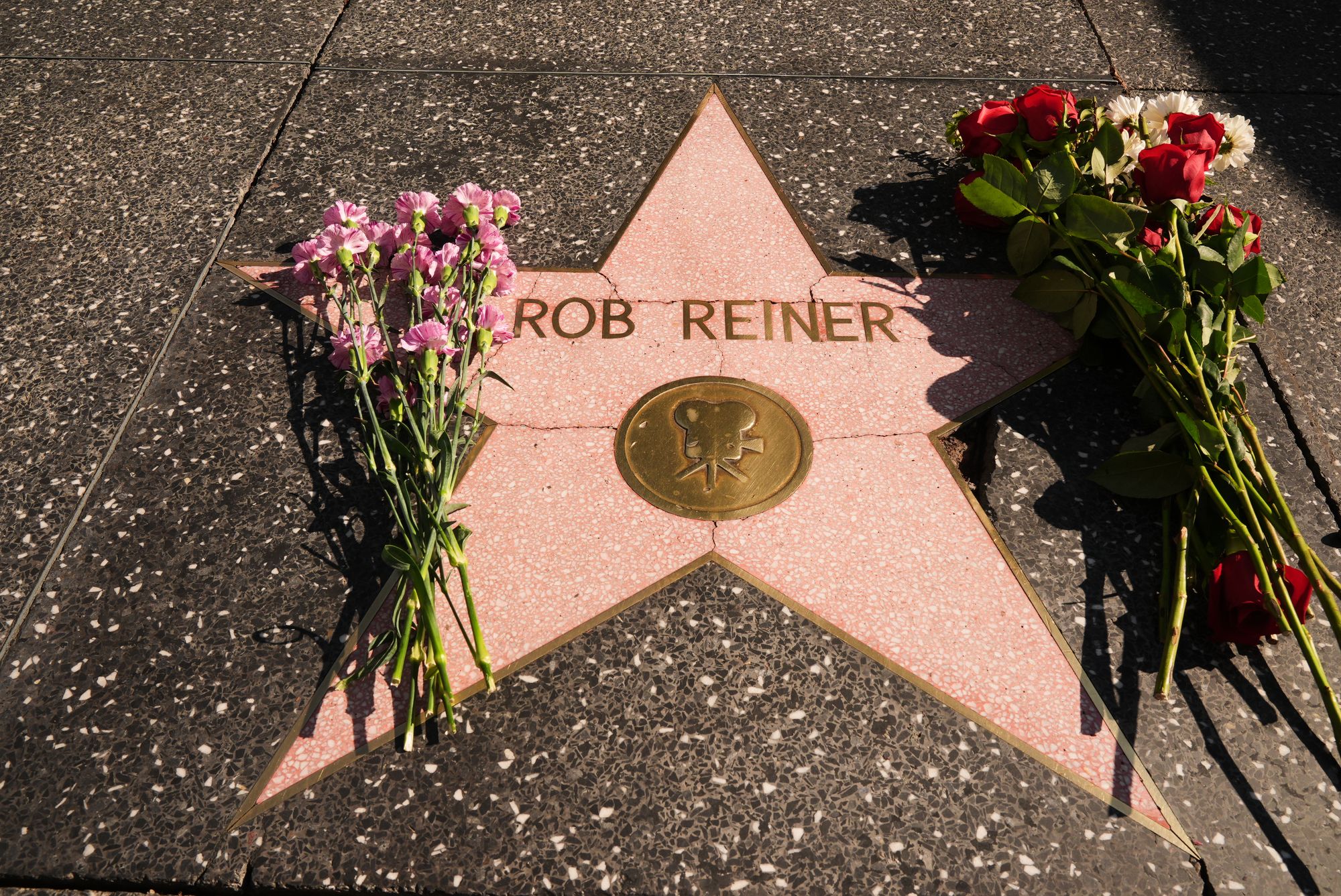 Flowers cover the Walk of Fame star for Rob Reiner Monday, Dec. 15, 2025, in the Hollywood section of Los Angeles