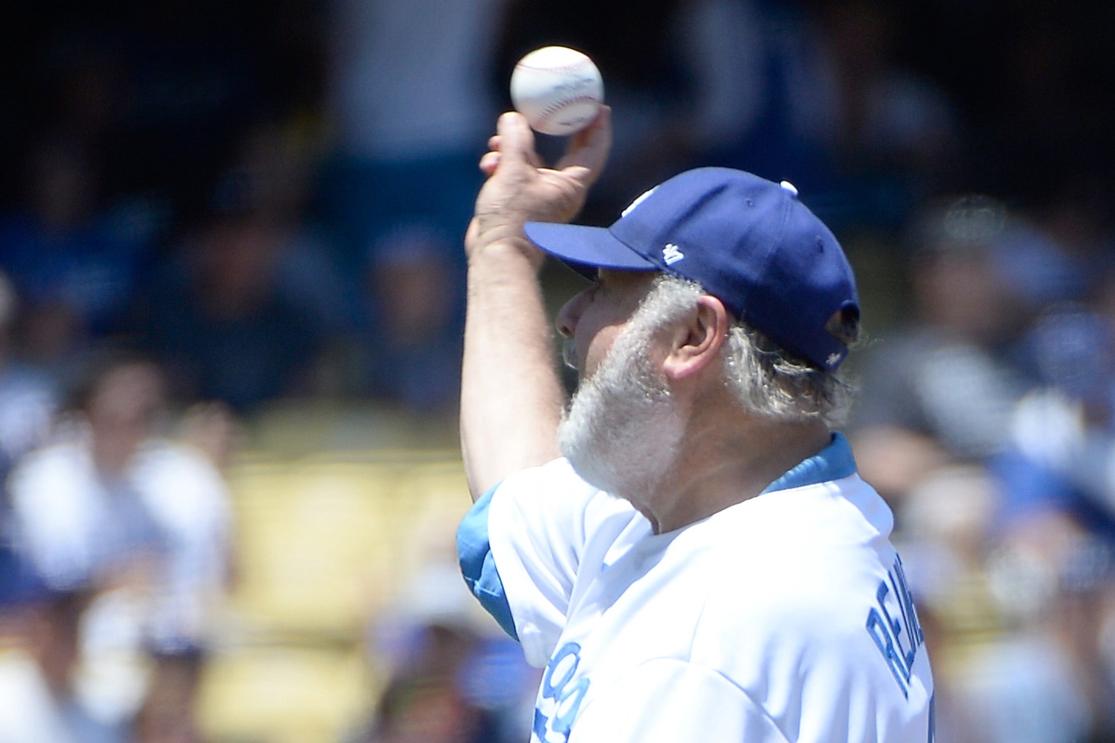 Rob Reiner throws out a ceremonial first pitch before the game between the San Diego Padres and the Los Angeles Dodgers at Dodger Stadium on July 13, 2014. Tributes have poured in for the director
