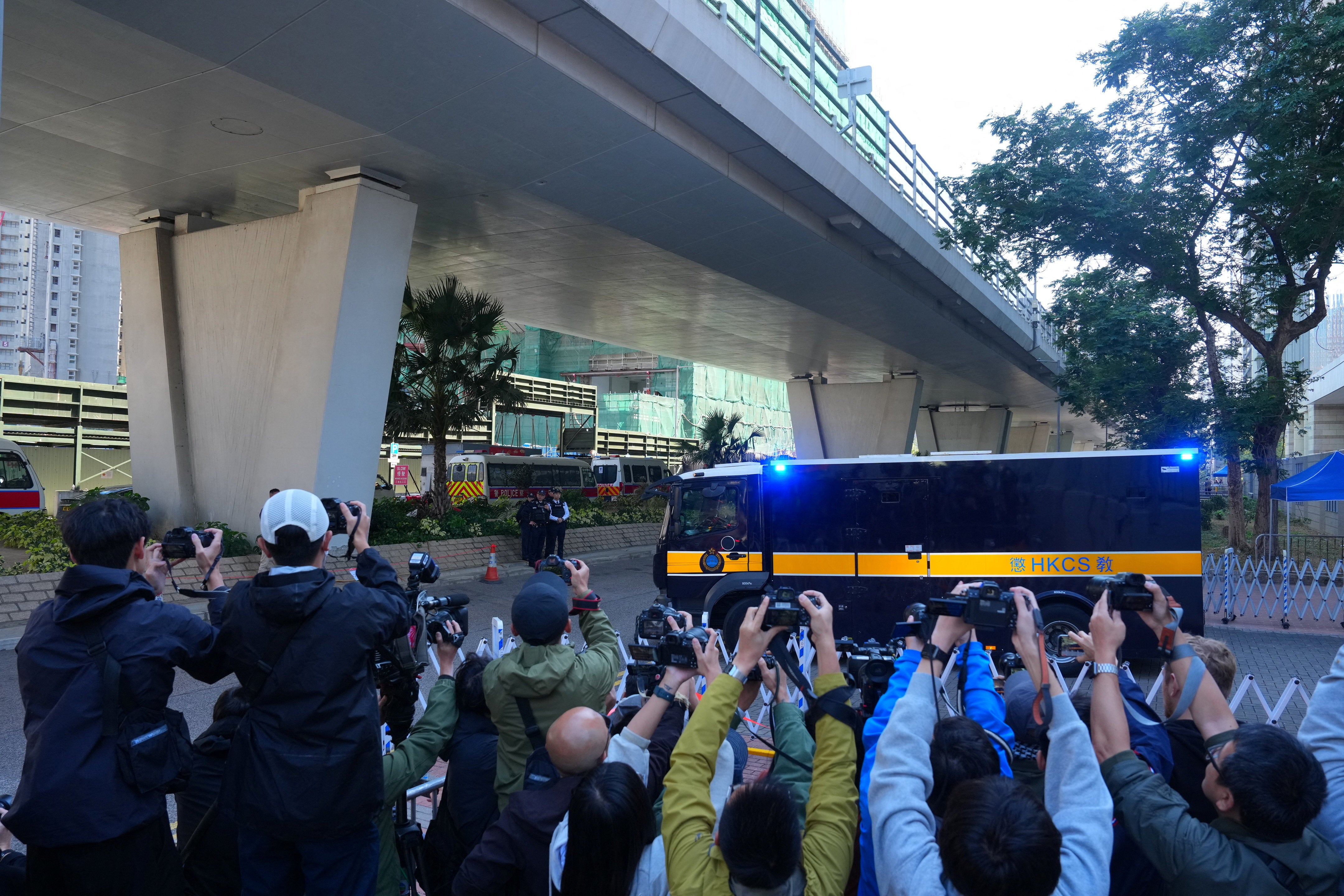 A prison van believed to be carrying Jimmy Lai, leaves the West Kowloon Magistrates' Courts building after the verdict in the national security collusion trial of Jimmy Lai, founder of the now-defunct pro-democracy newspaper Apple Daily