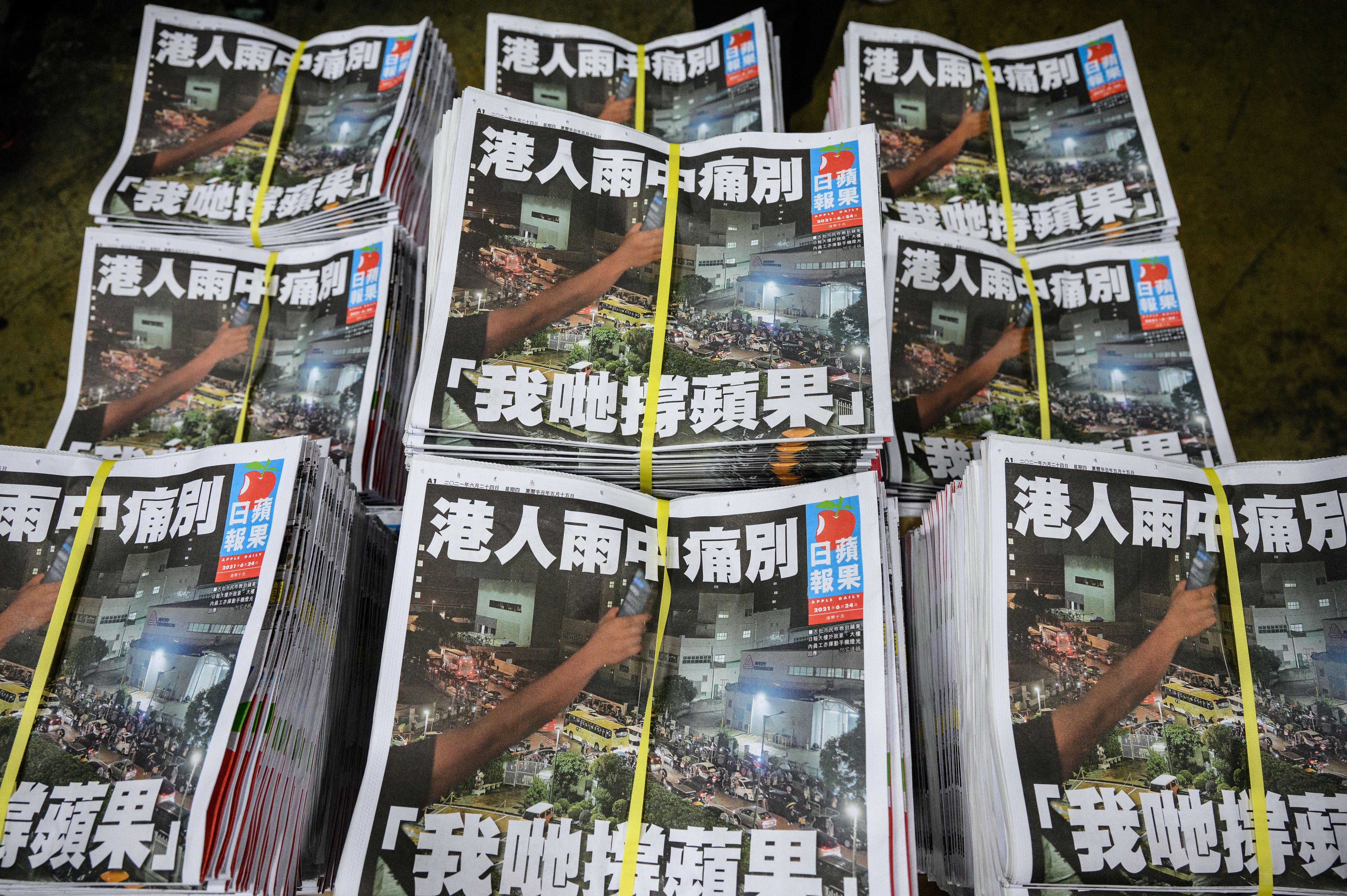 File Copies of the last Apple Daily newspaper are seen stacked in Hong Kong early on 24 June 2021
