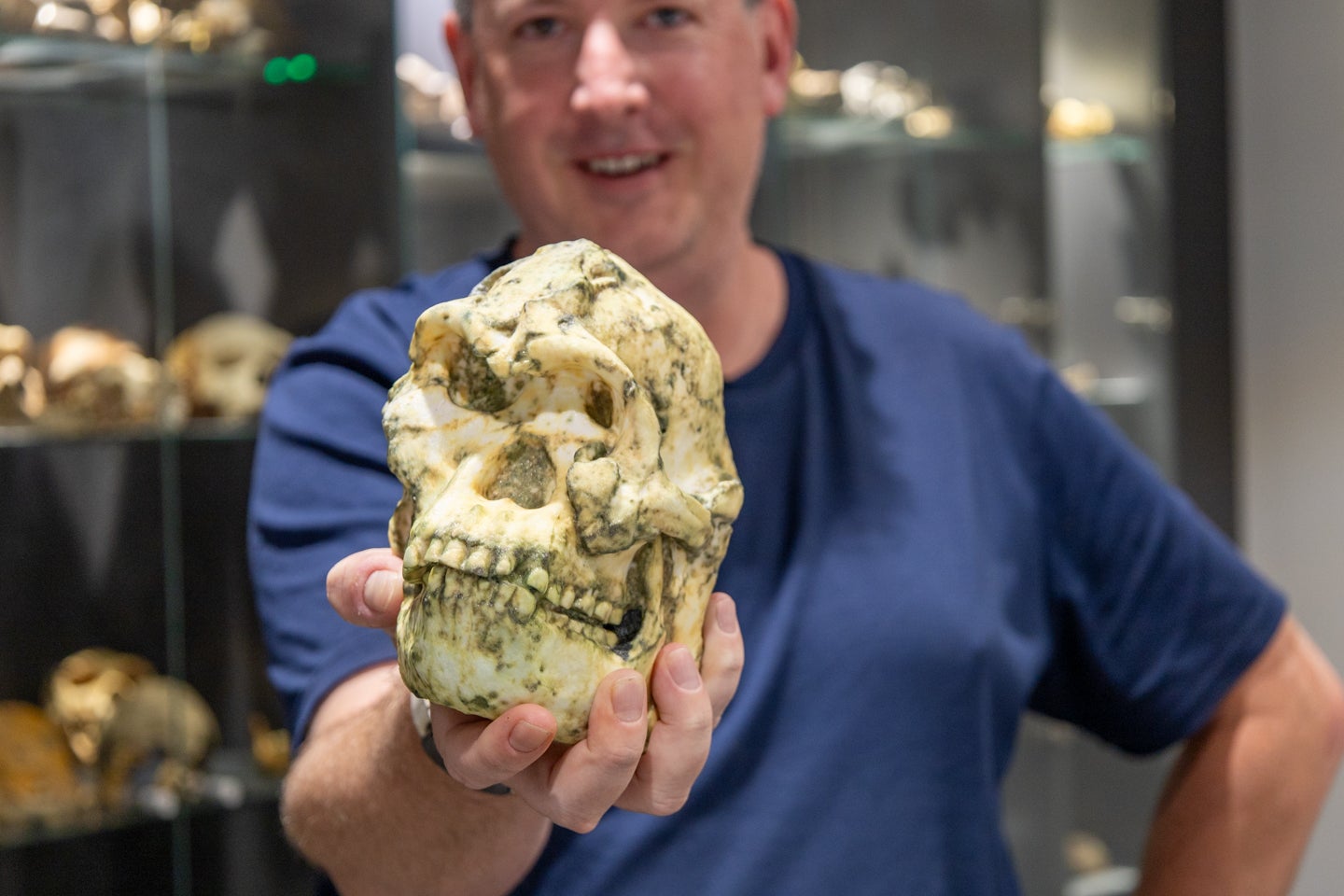 Jesse Martin holding a 3D print of the Little Foot skull