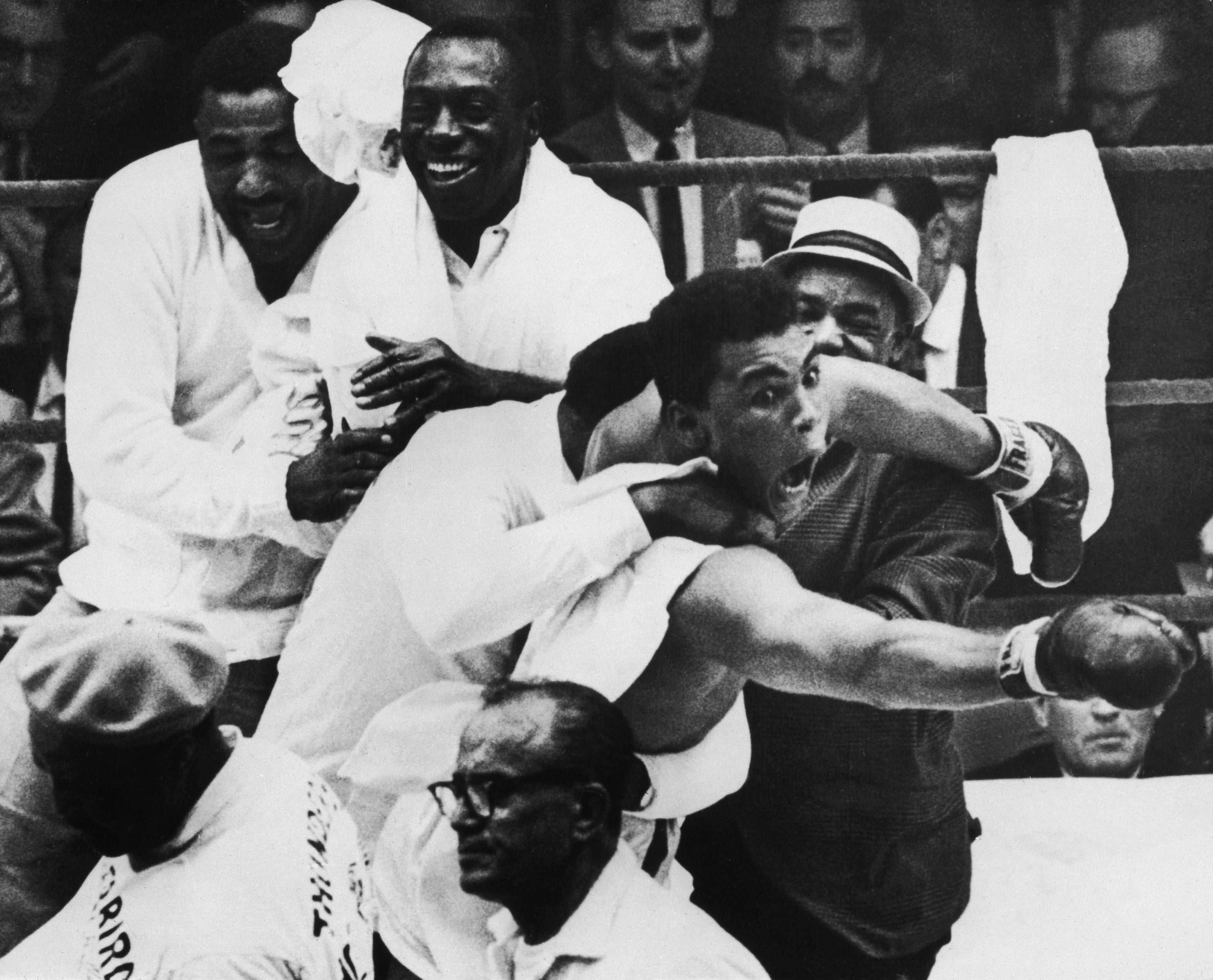 A 22-year-old Cassius Clay celebrates stopping Sonny Liston in February 1964