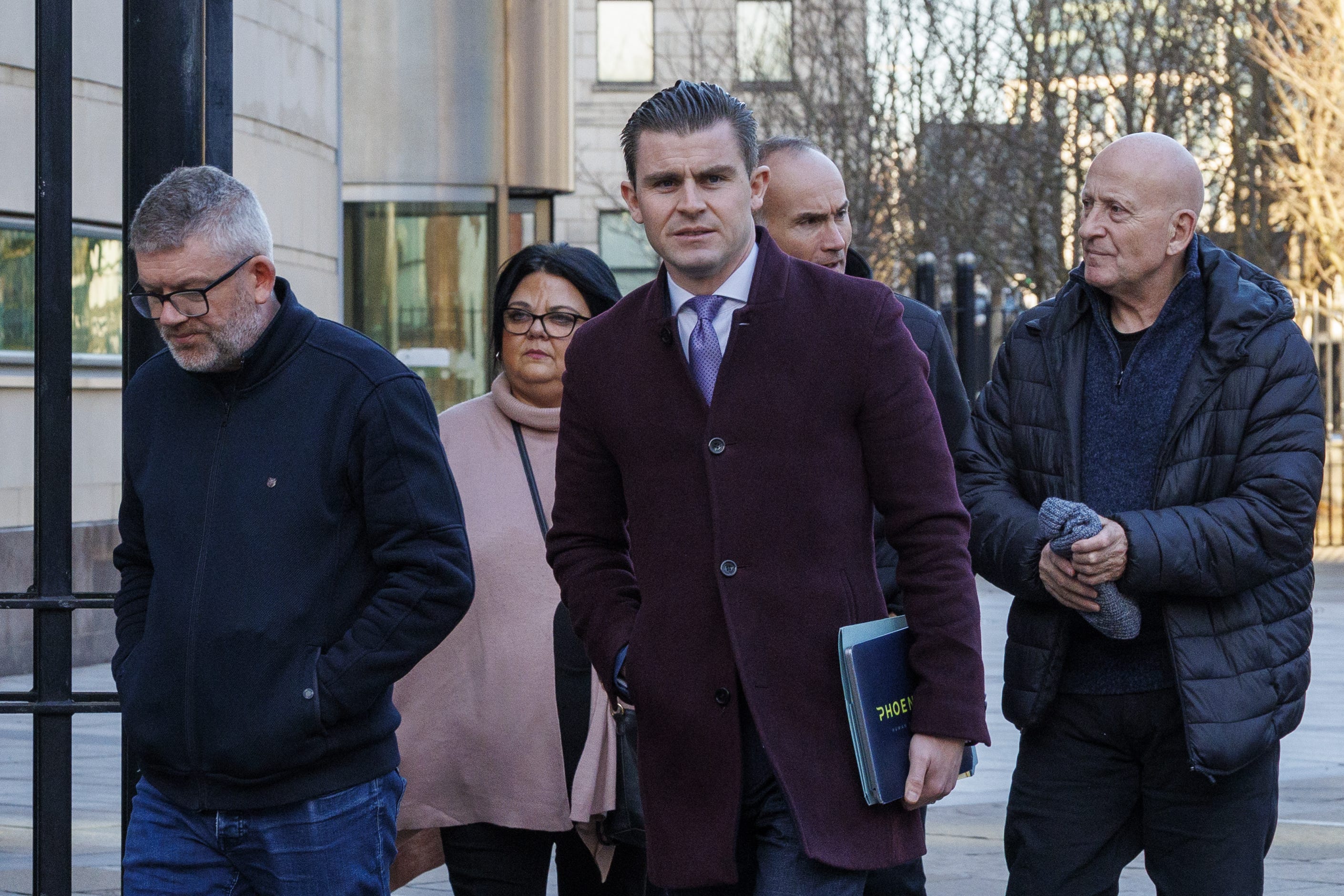 From left, James Bradley, father of Morgan Barnard, Ciara Currie, mother of Connor Currie, solicitor Darragh Mackin, Eamonn Currie, father of Connor Currie, Eddie Barnard, uncle of Morgan Barnard outside Belfast Coroner’s Court, after the preliminary inquest hearing (Liam McBurney/PA)