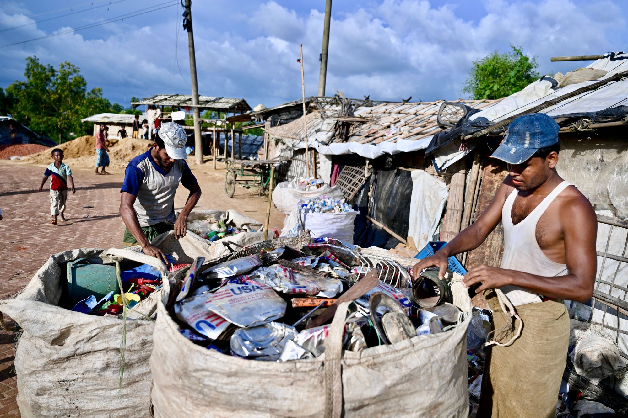 Rohingya refugees collect waste around Cox's Bazar