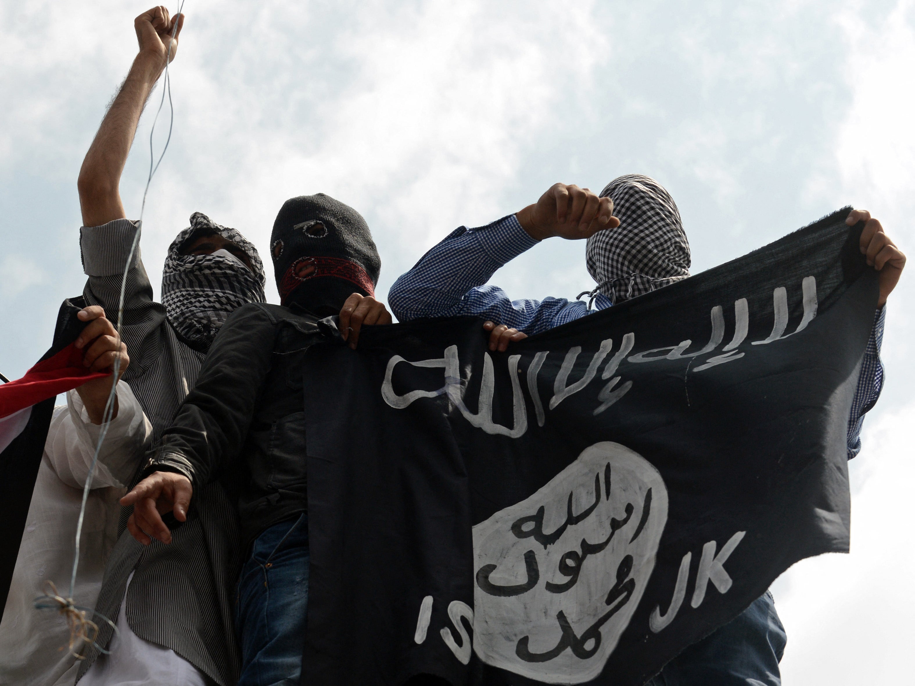 Demonstrators hold up an Isis flag as they protest against the Israeli occupation of Gaza in 2014