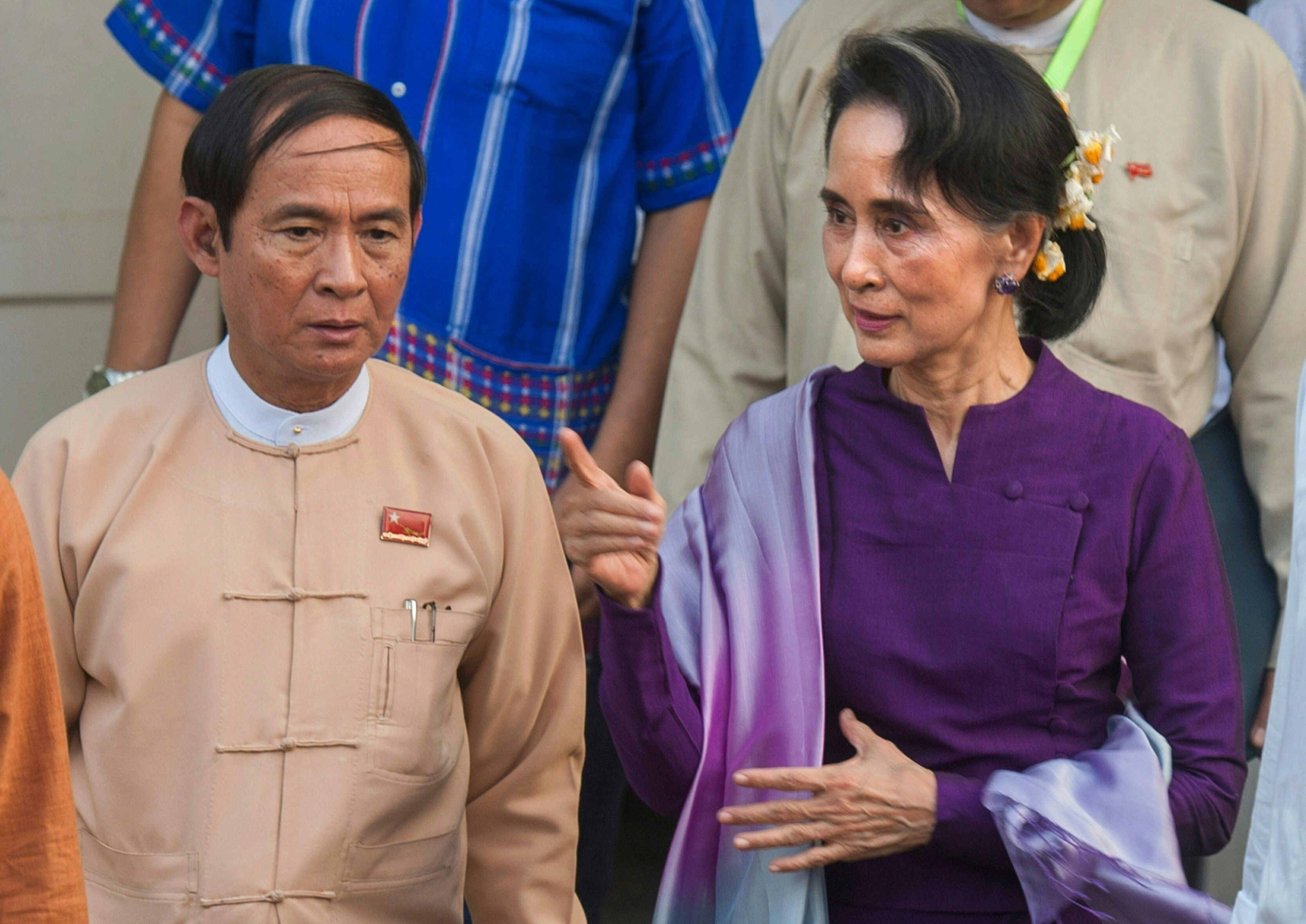 <p>Myanmar State Counsellor Aung San Suu Kyi is accompanied by Lower House speaker Win Myint in 2016 after a meeting of National League for Democracy (NLD) members of parliament in Naypyidaw</p>