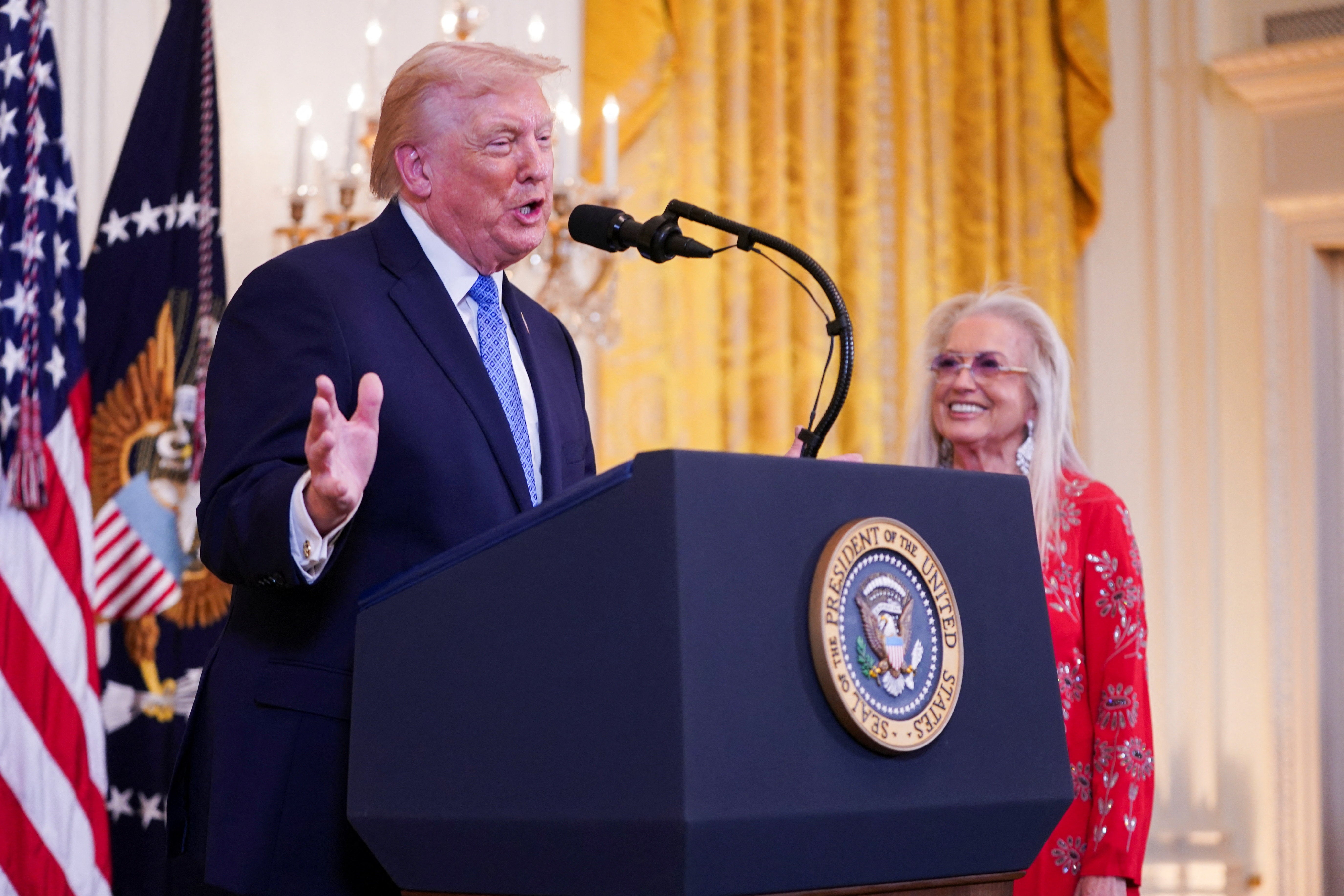 Trump called up prominent supporters, including billionaire donor Miriam Adelson, to fawn over him on stage