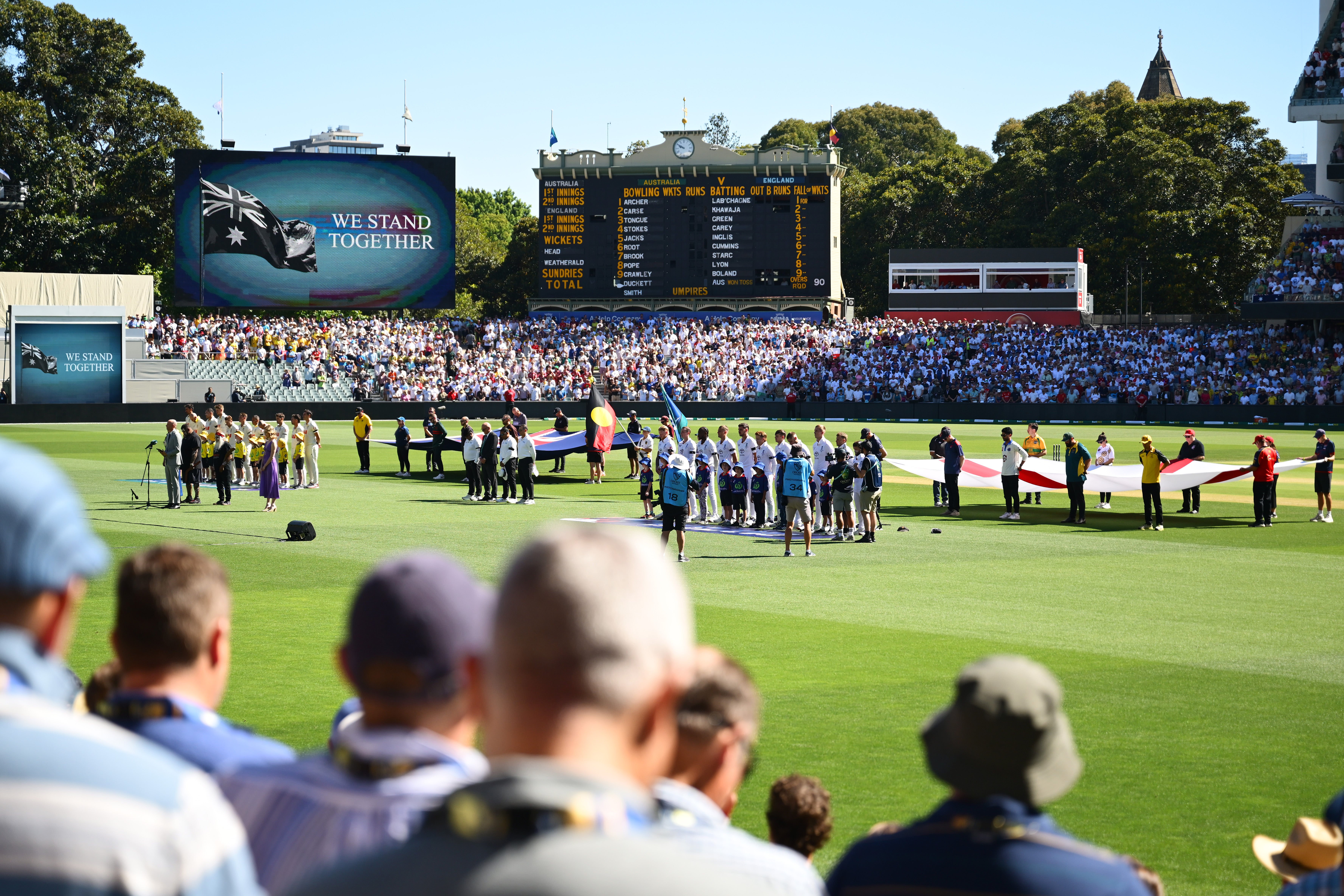 Players, officials and spectators observed a moment’s silence before the start of play
