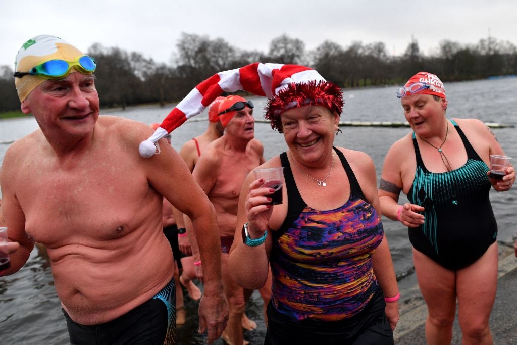 Swimmers enjoy a glass of red wine after their Christmas Day swim in London's Hyde Park