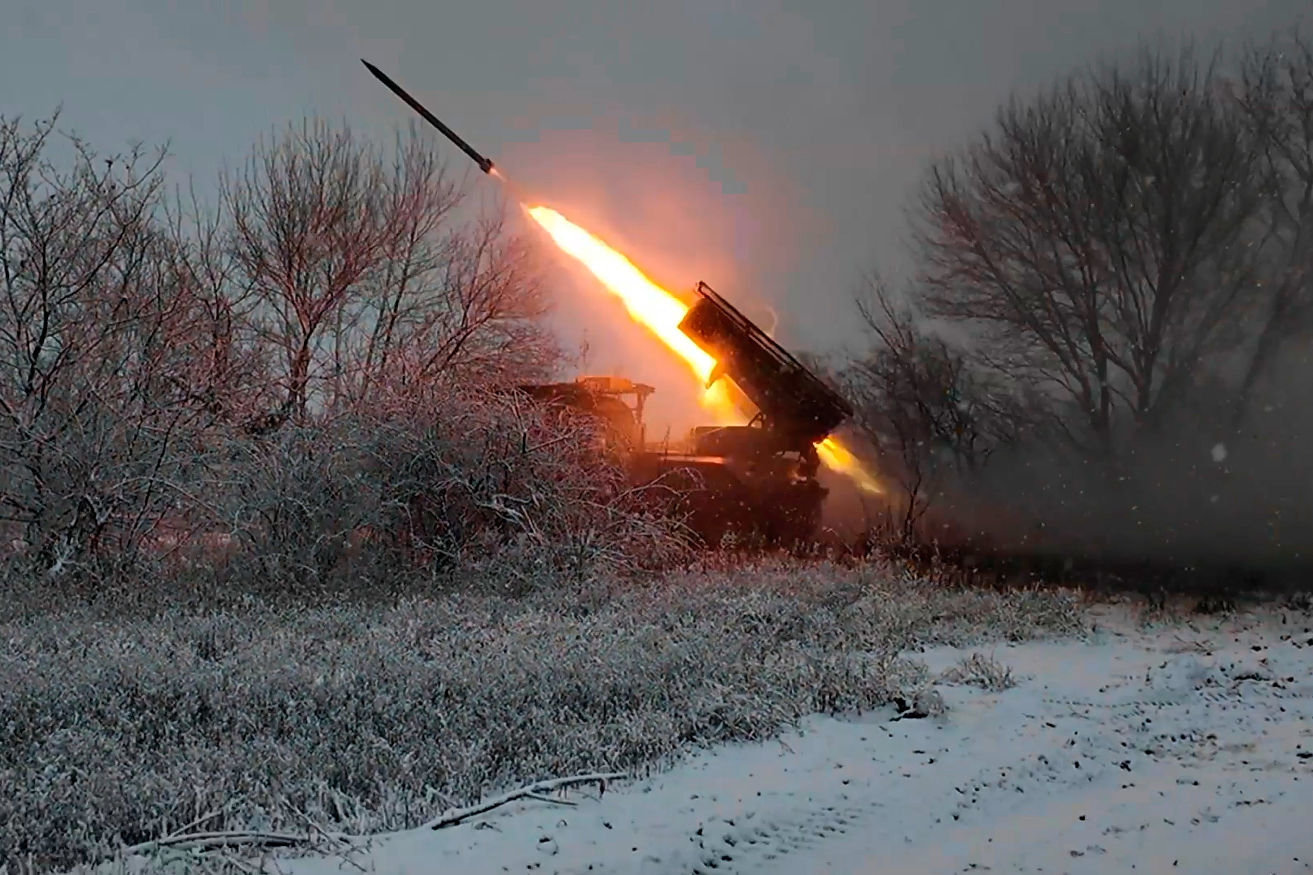 A self-propelled multiple rocket launcher fires towards Ukrainian troops