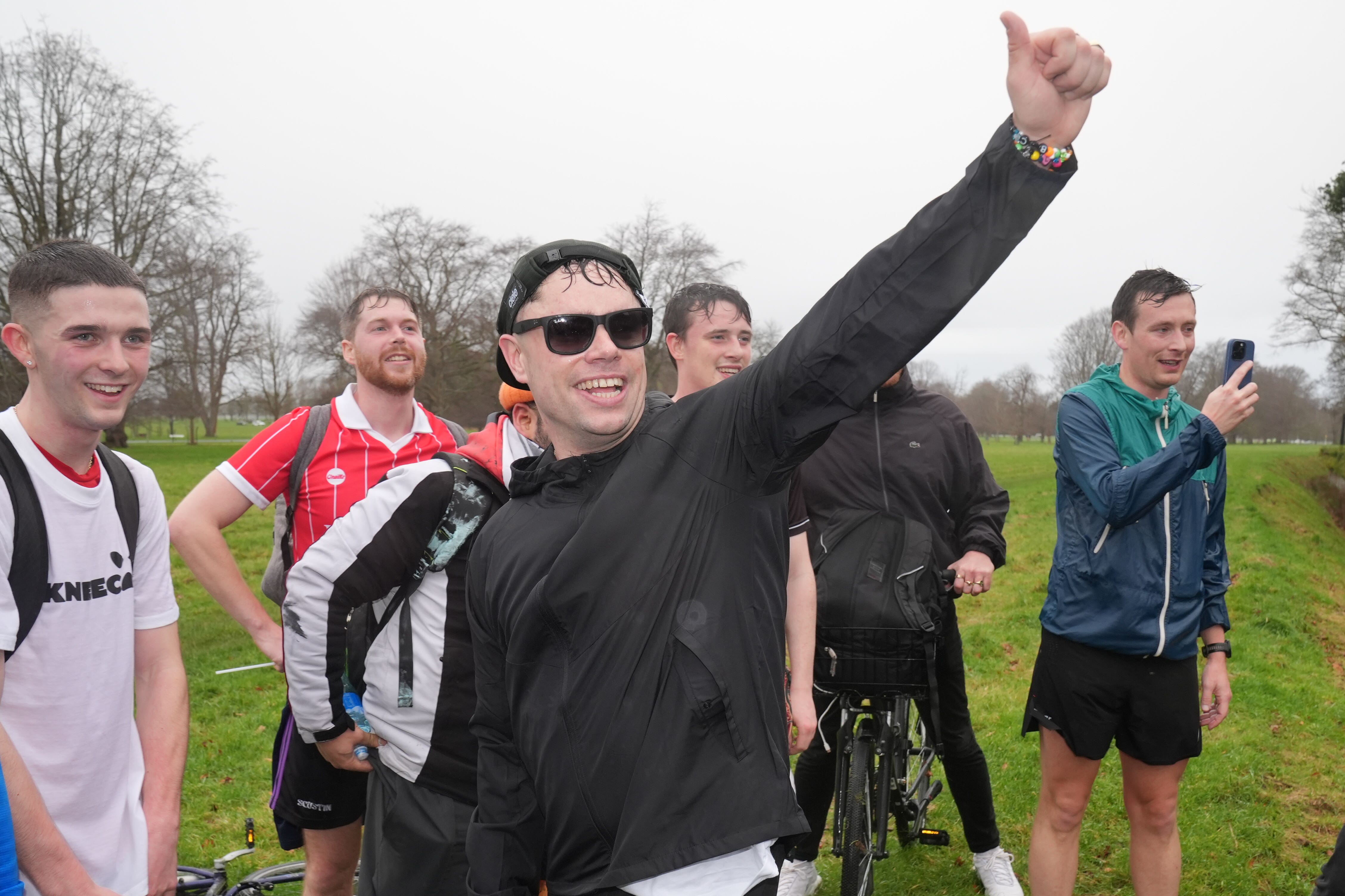 Kneecap member Naoise O Caireallain (Moglai Bap) gives a thumbs up to President Catherine Connolly in Dublin’s Phoenix Park (Brian Lawless/PA)