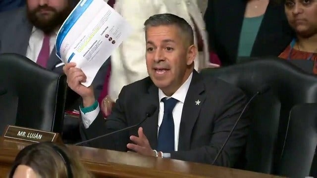 Sen. Ben Ray Luján (D-NM) shows Brendan Carr that the FCC's website shows that it is an independent government agency. That definition was changed during the hearing.