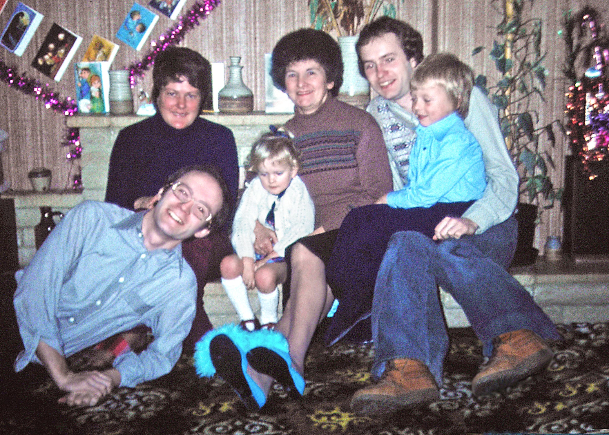 <p>Peter Boxell, far left, with his son Lee, far right, and other family members during a Christmas before Lee went missing</p>