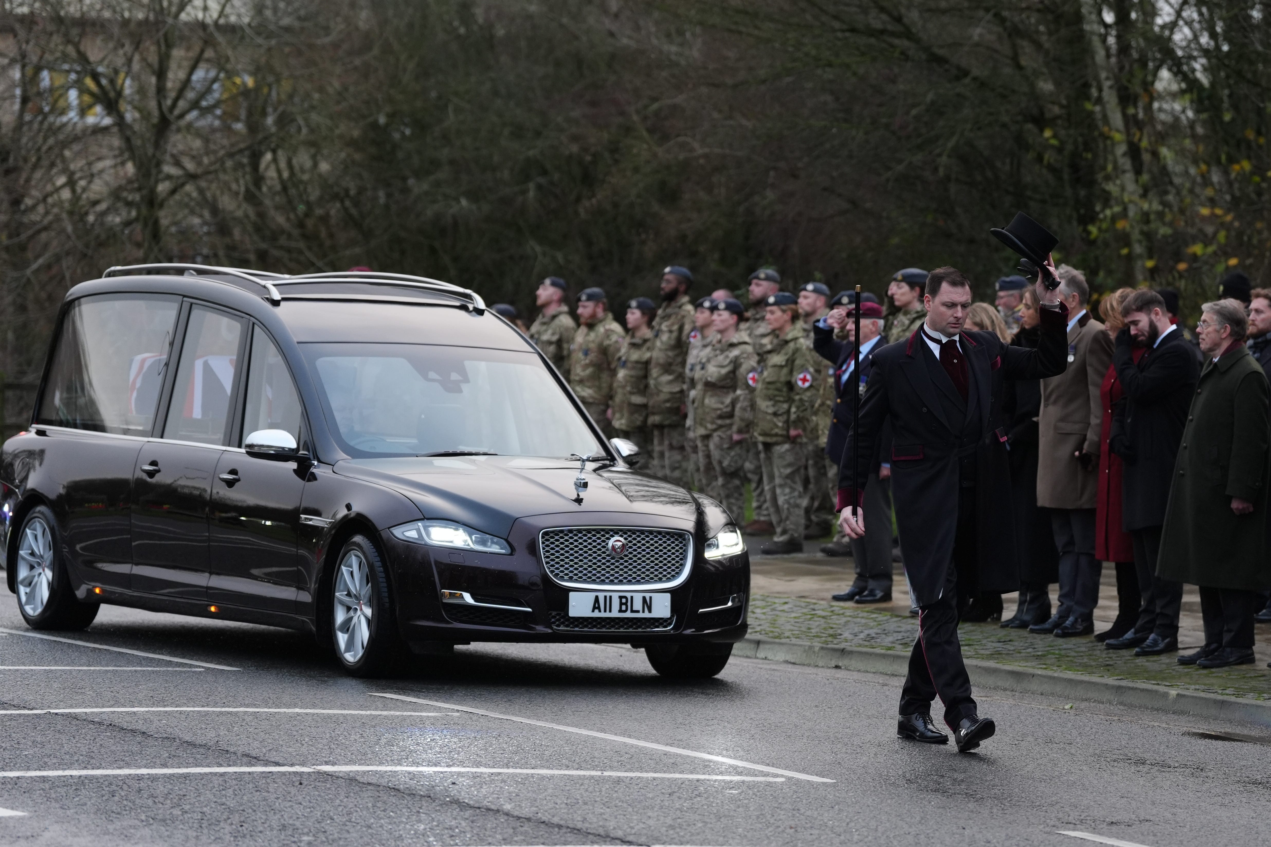 The cortege carrying the body of Lance Corporal George Hooley passes the Memorial Garden in Carterton, West Oxfordshire, following his repatriation into RAF Brize Norton (Ben Whitley/PA)