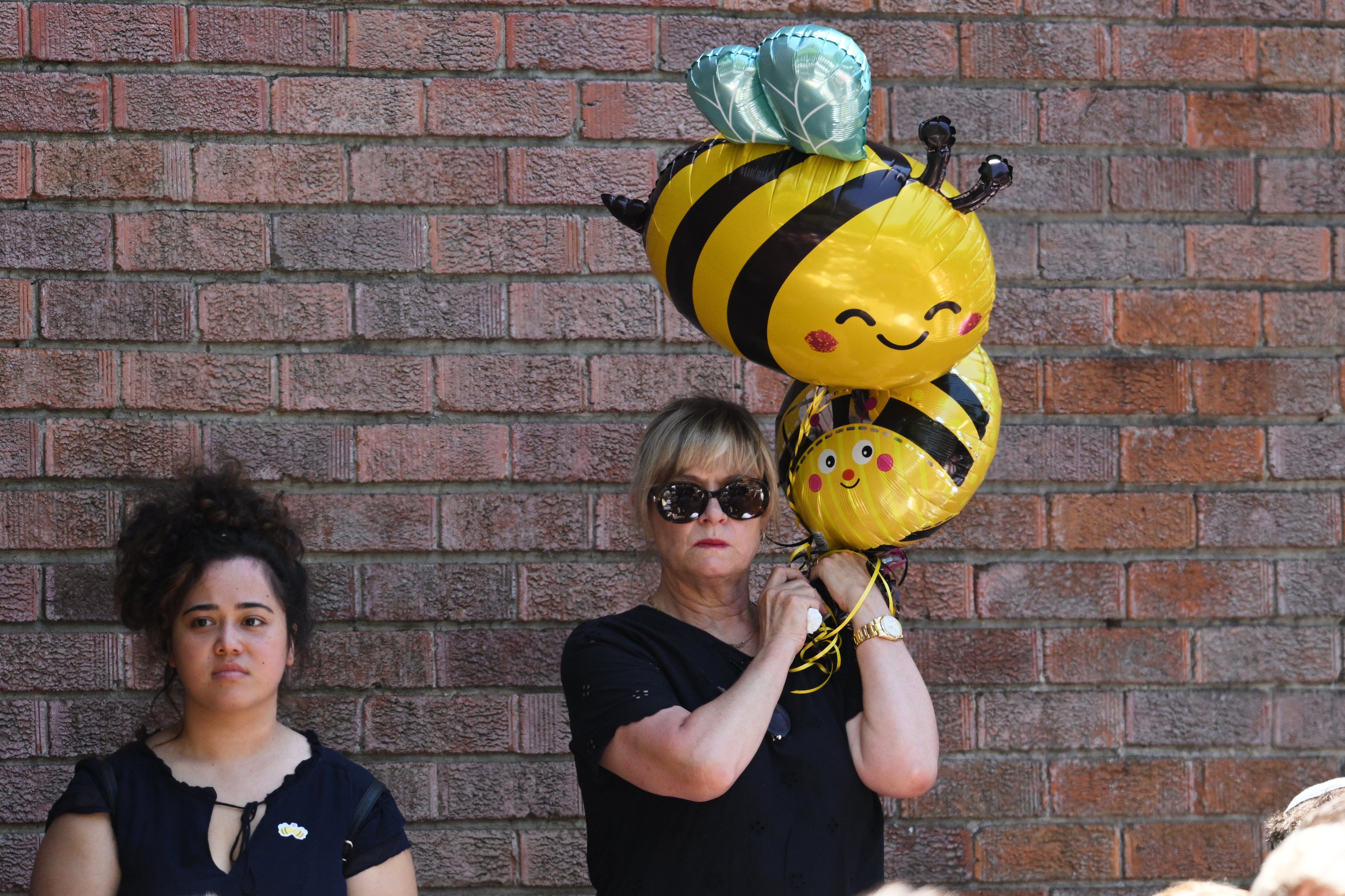 A mourner holds bumblebee balloons at the funeral of Bondi Beach mass shooting victim 10-year-old Matilda, whose last name is being withheld at the request of her family, in Sydney, Thursday, 18 December 2025