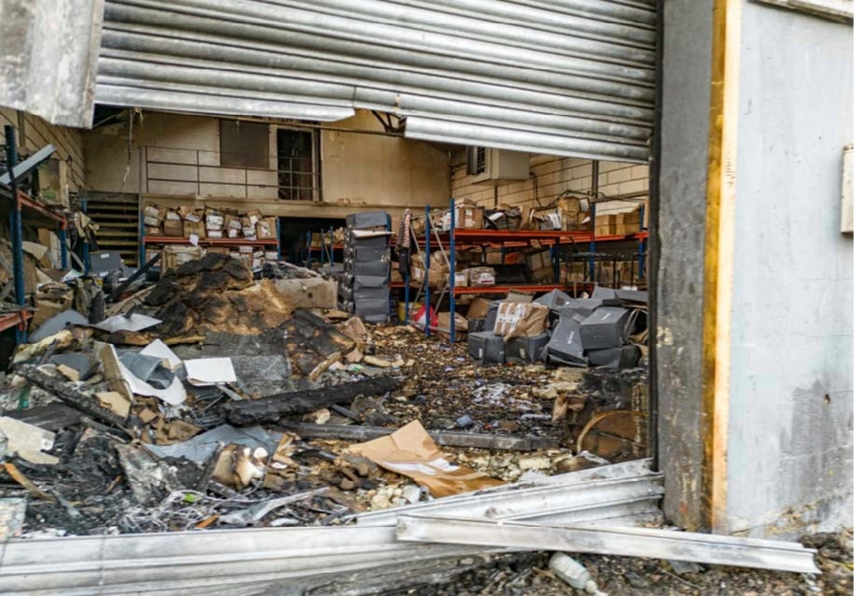 Damage to a warehouse in east London that was storing goods for Ukraine, after a fire that prosecutors said was organised on behalf of Russia's intelligence services
