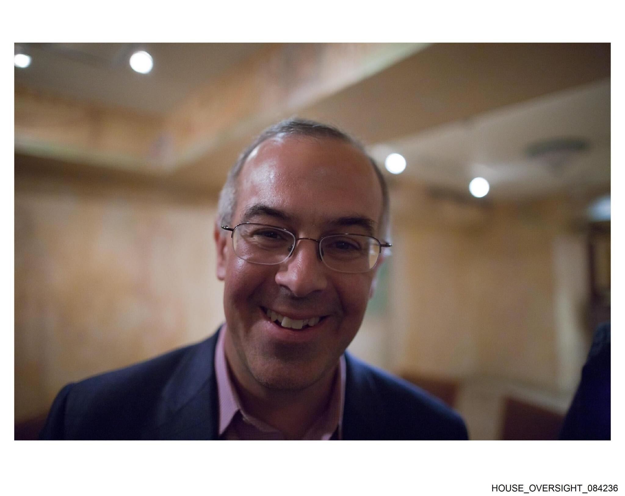 Brooks could be seen smiling directly at the camera while having drinks and eating dinner with other guests in one photo