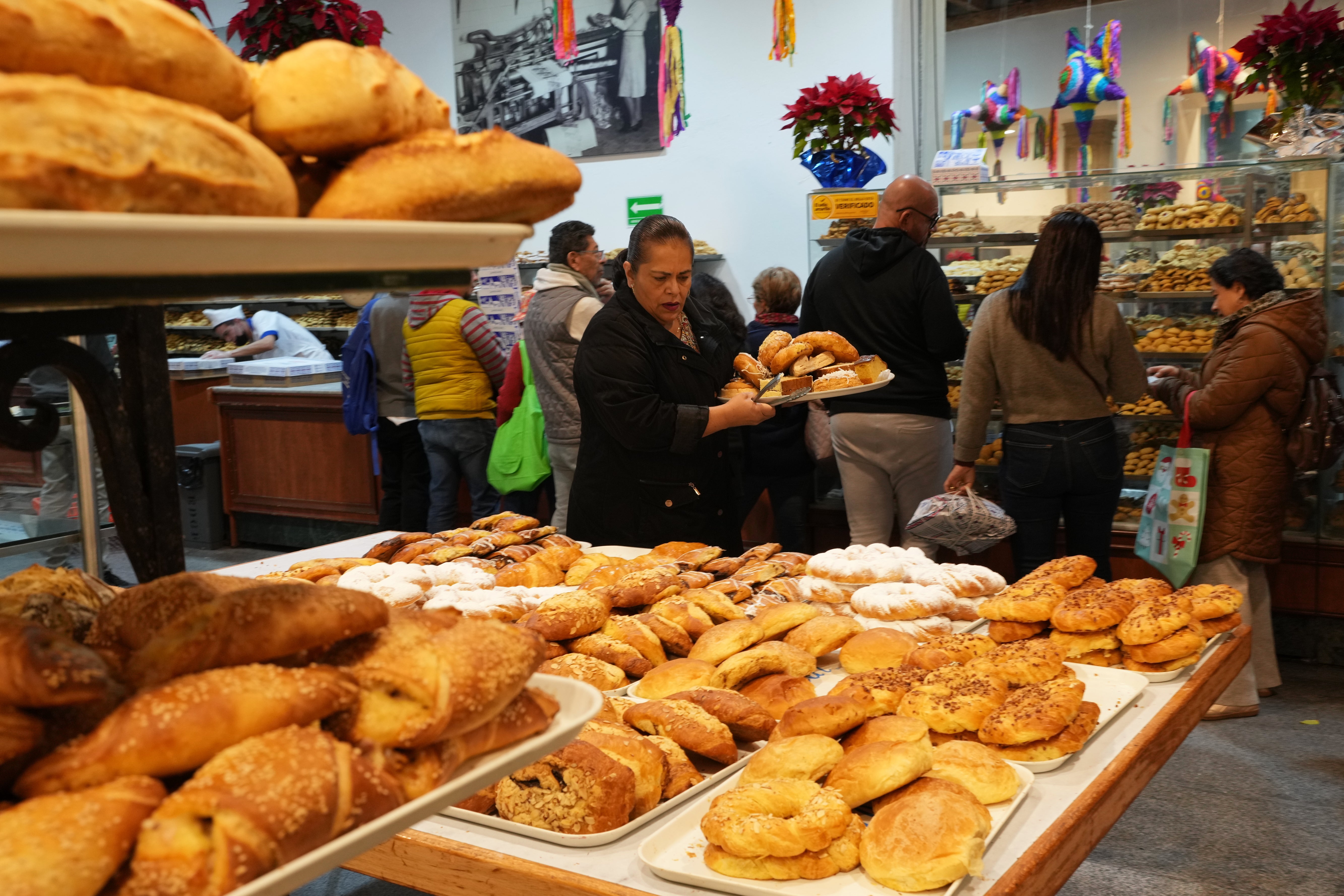 People buy pastries at a bakery in Mexico City.