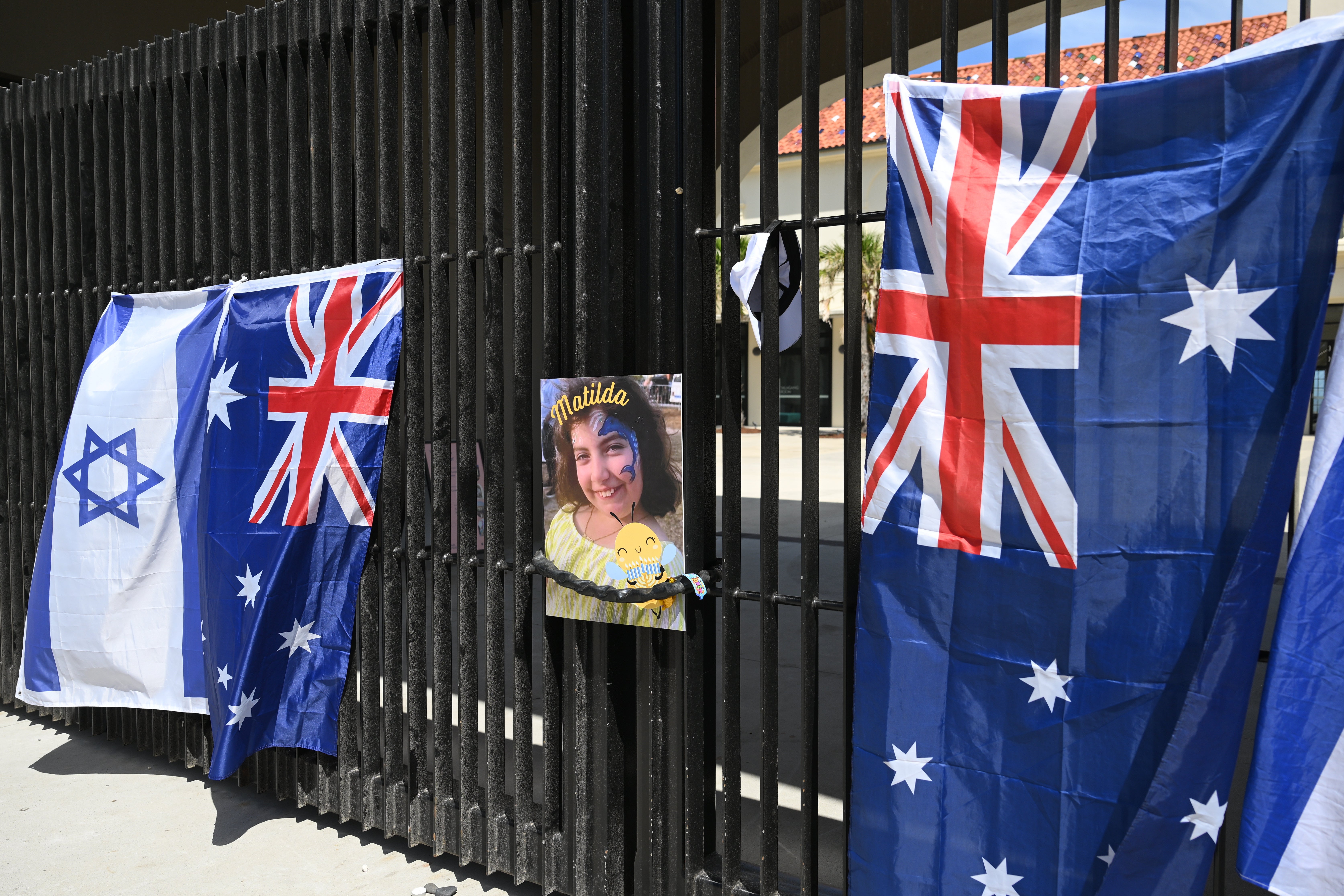 A photo of Bondi Beach mass shooting victim, 10-year-old Matilda, whose last name is being withheld at the request of her family, hangs on a fence at the Bondi Pavilion in Sydney, Thursday, 18 December 2025