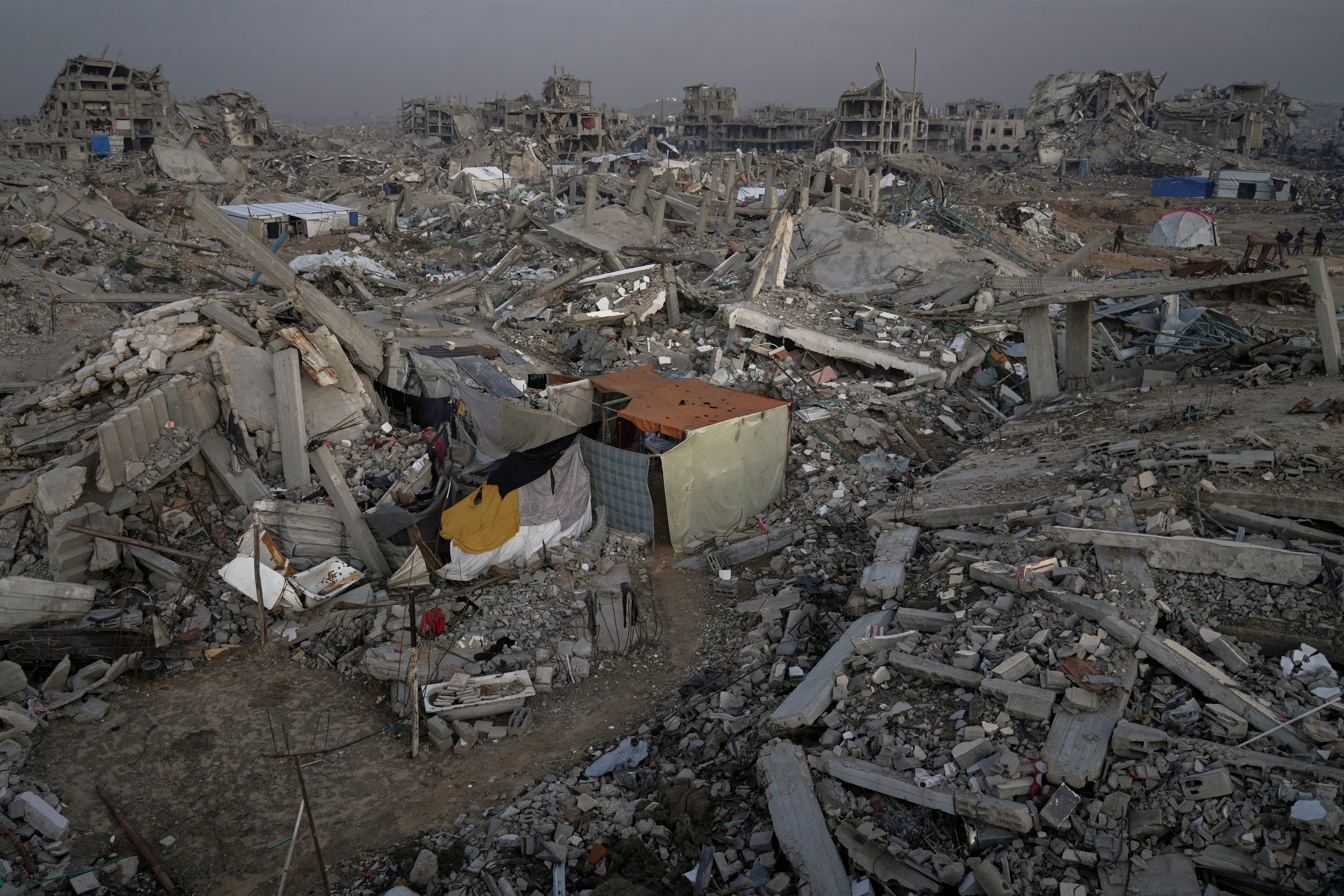 A family tent stands among the ruins of homes in the Al-Zaytoun neighbourhood of Gaza City