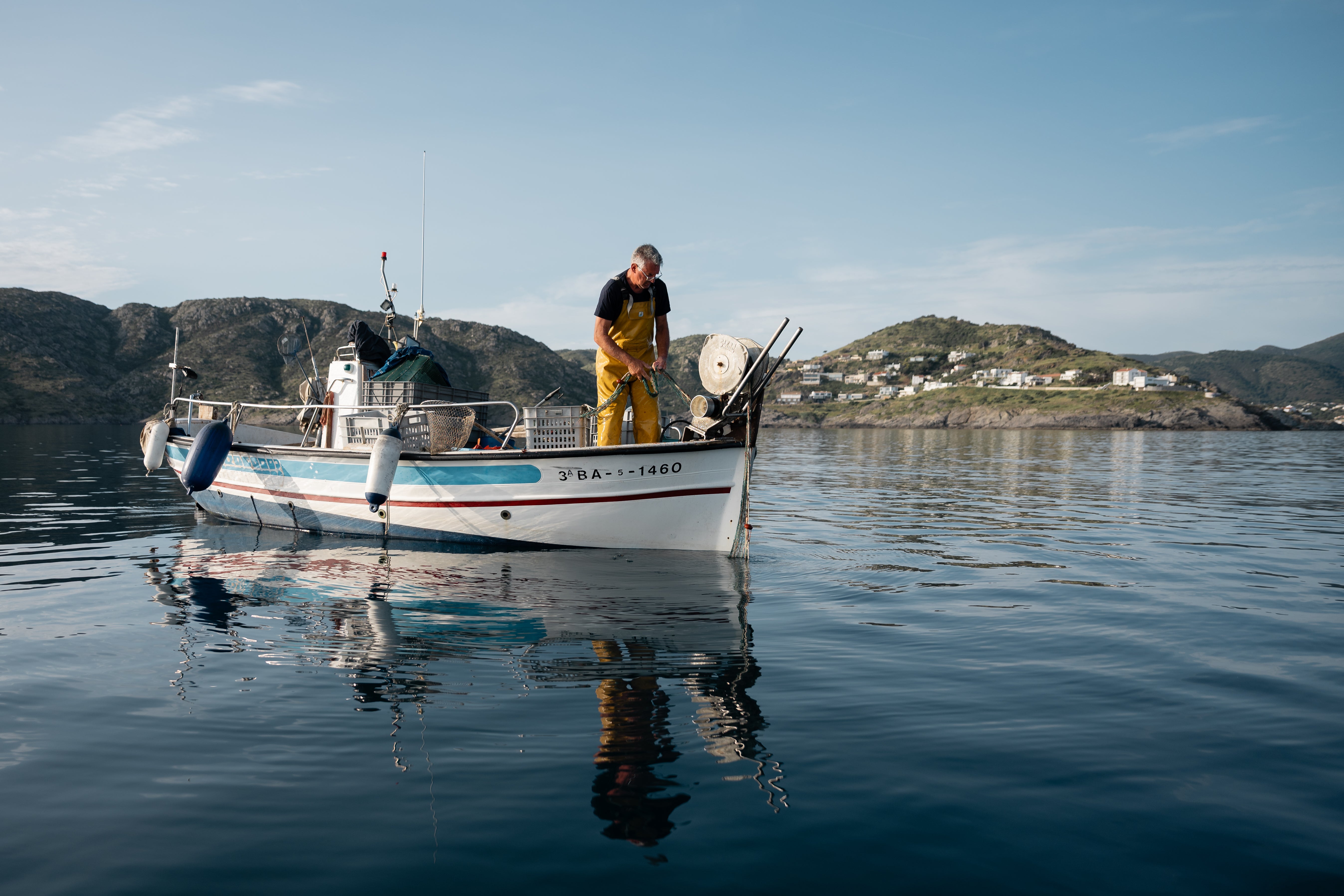 A fisherman setting out to save corals off the coast of Llança