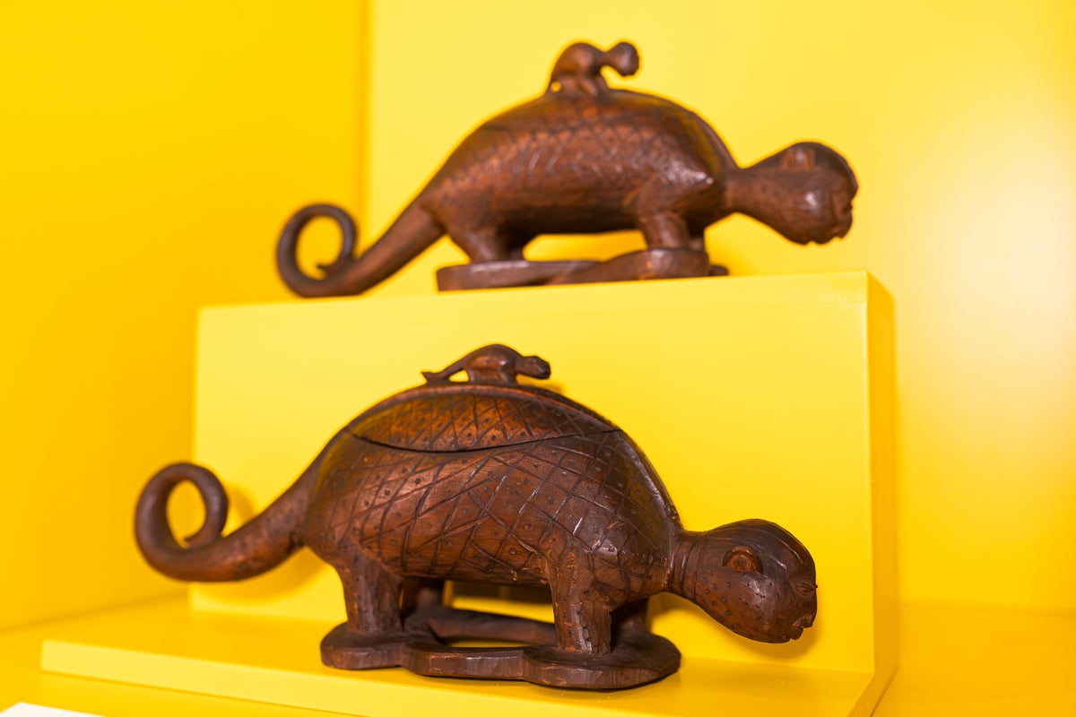 Two carved wooden animal vessels at the Africa Hub