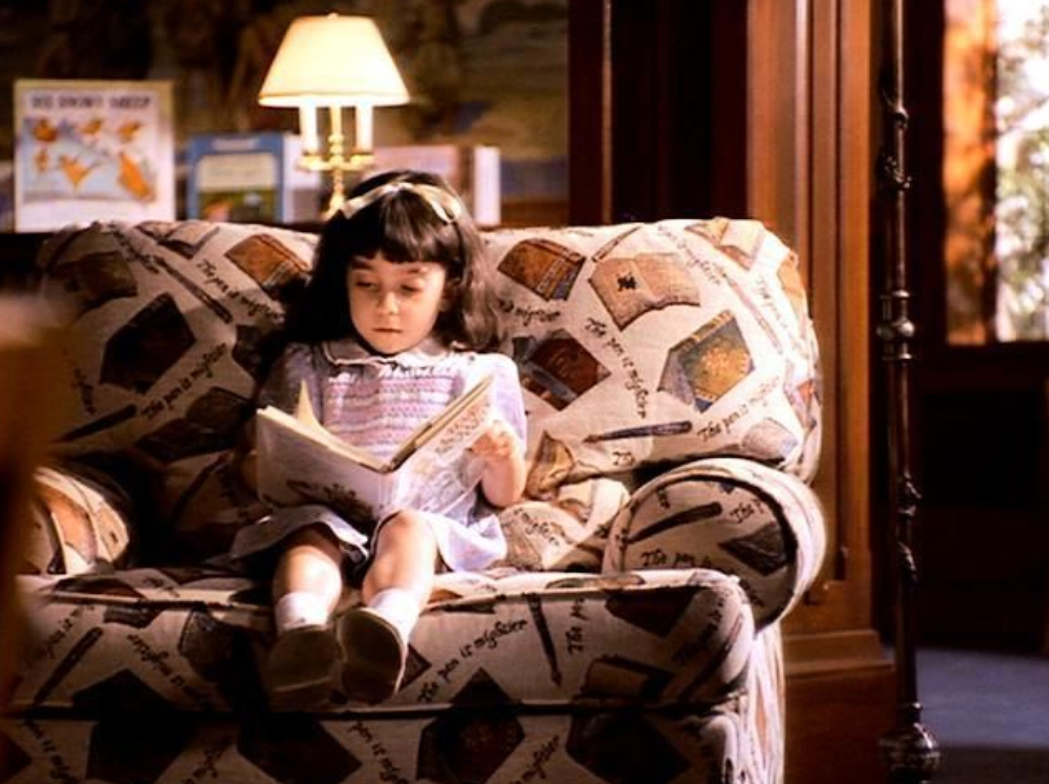 Matilda reads in the Edward L Doheny Jr Memorial Library, in the 1996 film adaptation of Roald Dahl’s book