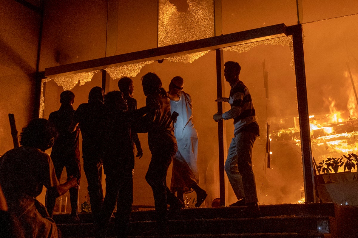 Angry mob sets fire to offices of leading newspapers after activist shot dead in Bangladesh