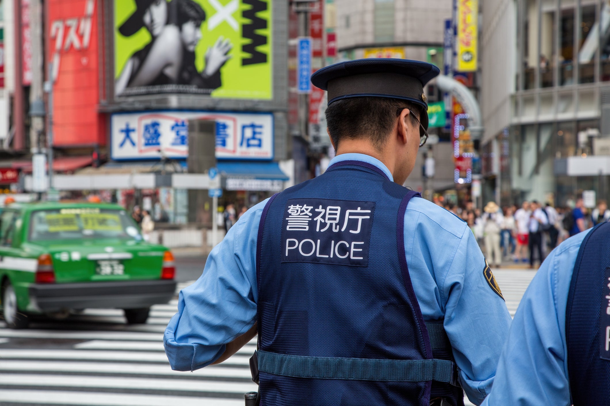 <p>File. Japanese police at Shibuya Crossing in Tokyo</p>