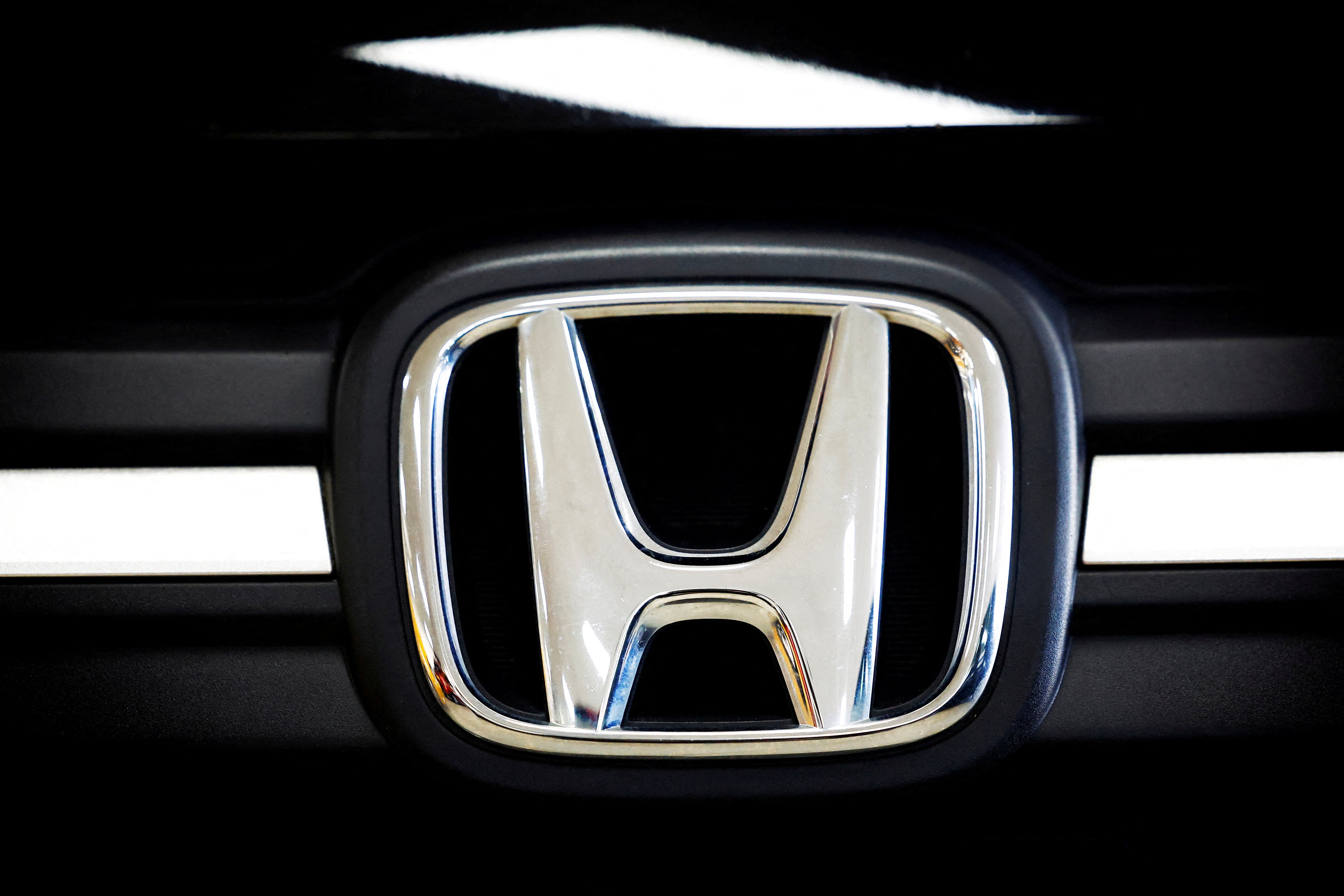 <p>A logo of Honda is seen inside a car dealer in Nijmegen</p>