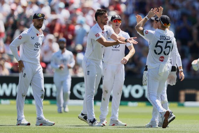 <p>England’s Josh Tongue, centre, is congratulated by team-mates after dismissing Australia’s Josh Inglis</p>