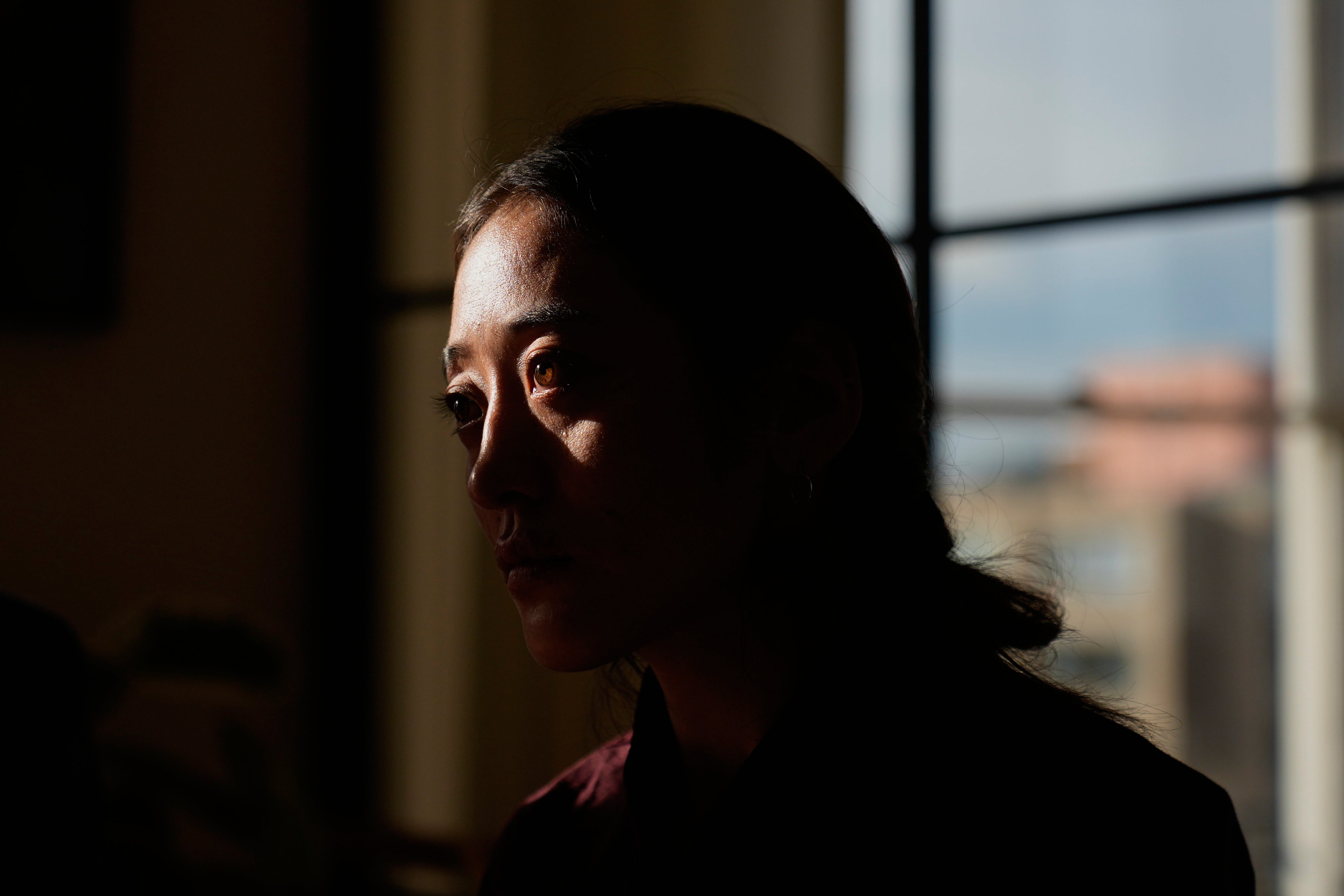 Namkyi, a Tibetan former political prisoner who was arrested at 15 and imprisoned for protesting Chinese rule, recounts her story during a meeting with staff at Vital Voices, a non-profit organization