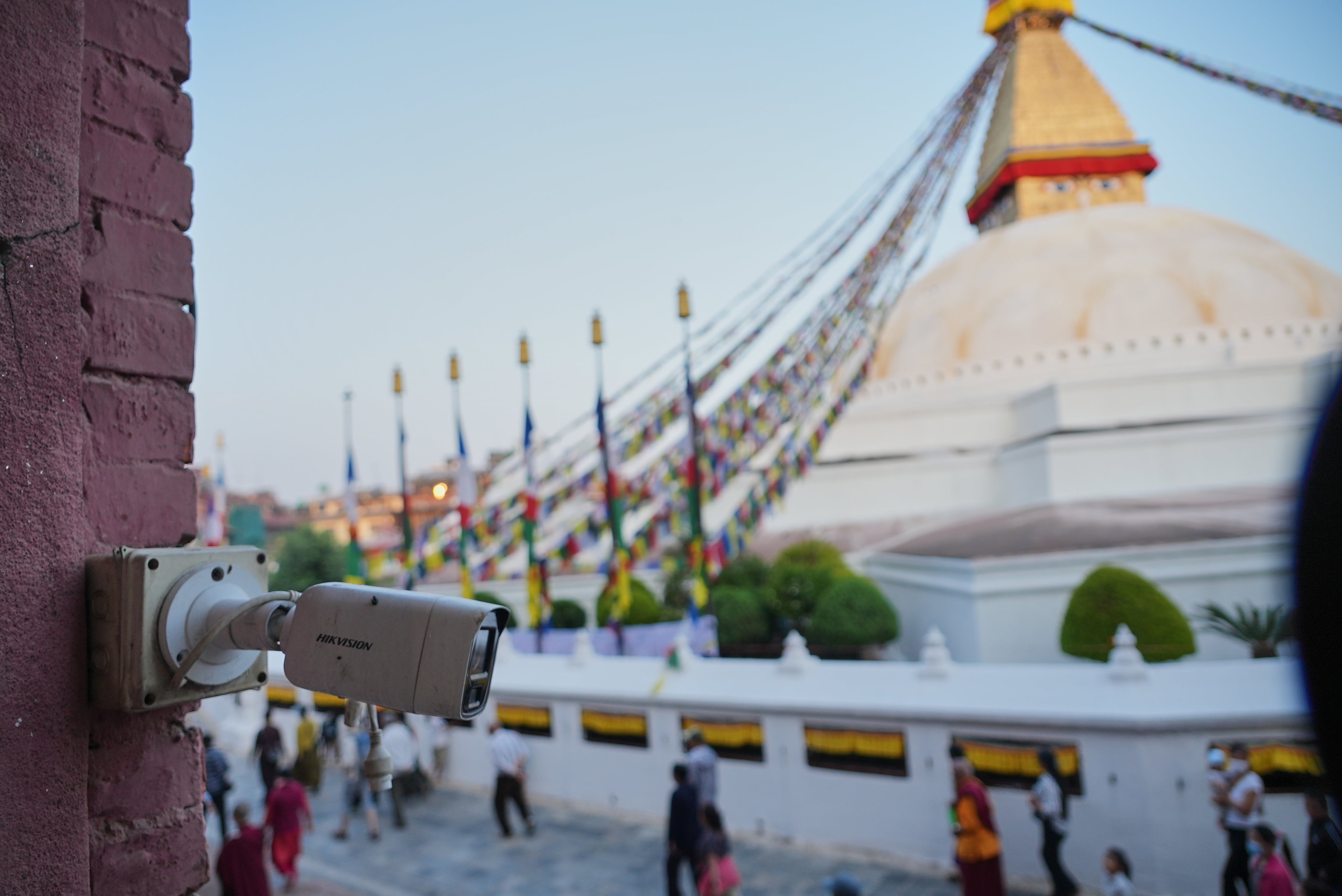 A Hikvision camera monitors crowds circling the Boudhanath, a holy Tibetan Buddhist stupa in Kathmandu, Nepal