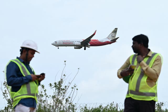 <p>An Air India Express aircraft prepares to land at Kempegowda International Airport in Bengaluru</p>