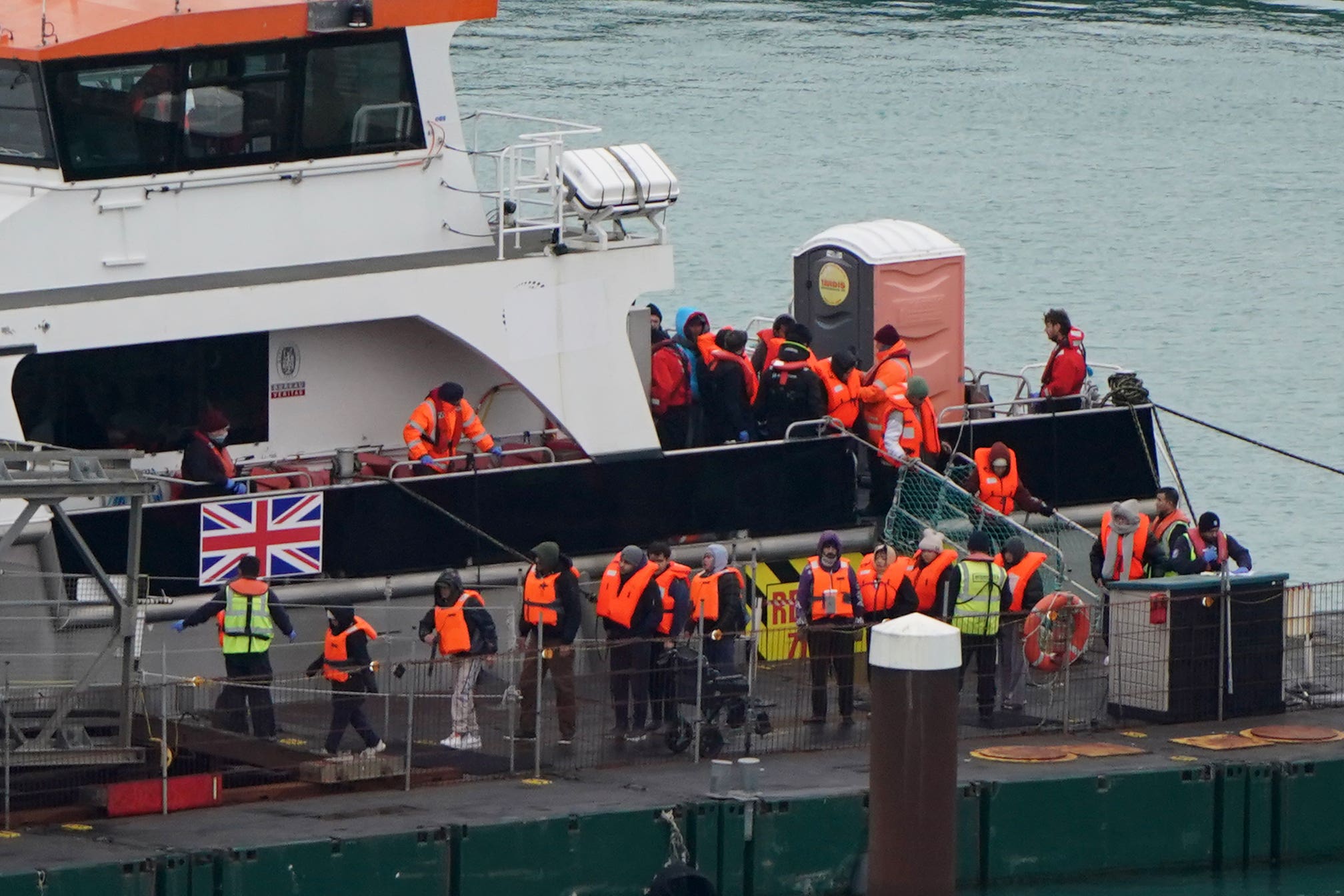A group of people thought to be migrants are brought into the Border Force compound in Dover (Gareth Fuller/PA)