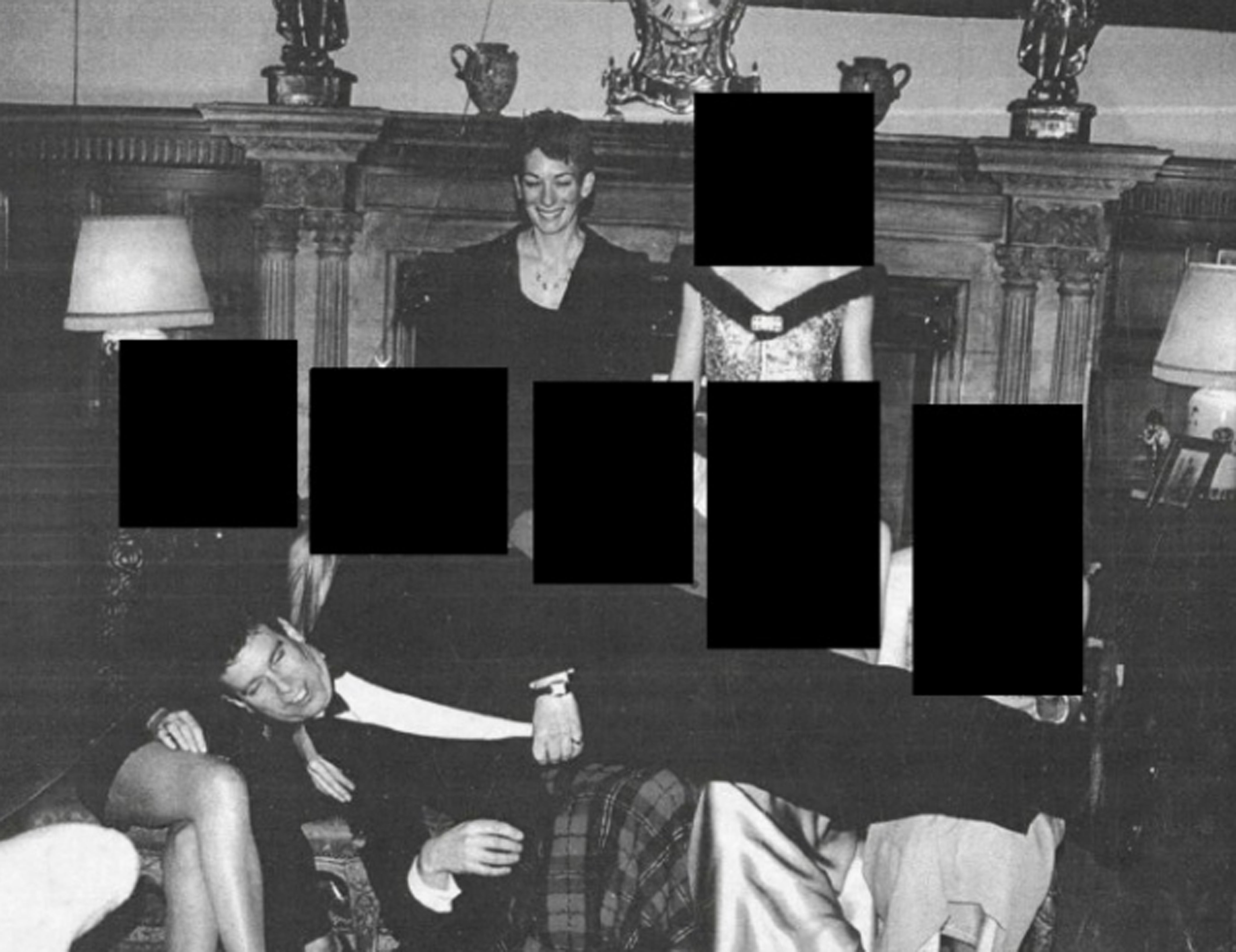 Andrew Mountbatten-Windsor was pictured reclining across the laps of five people in released photos