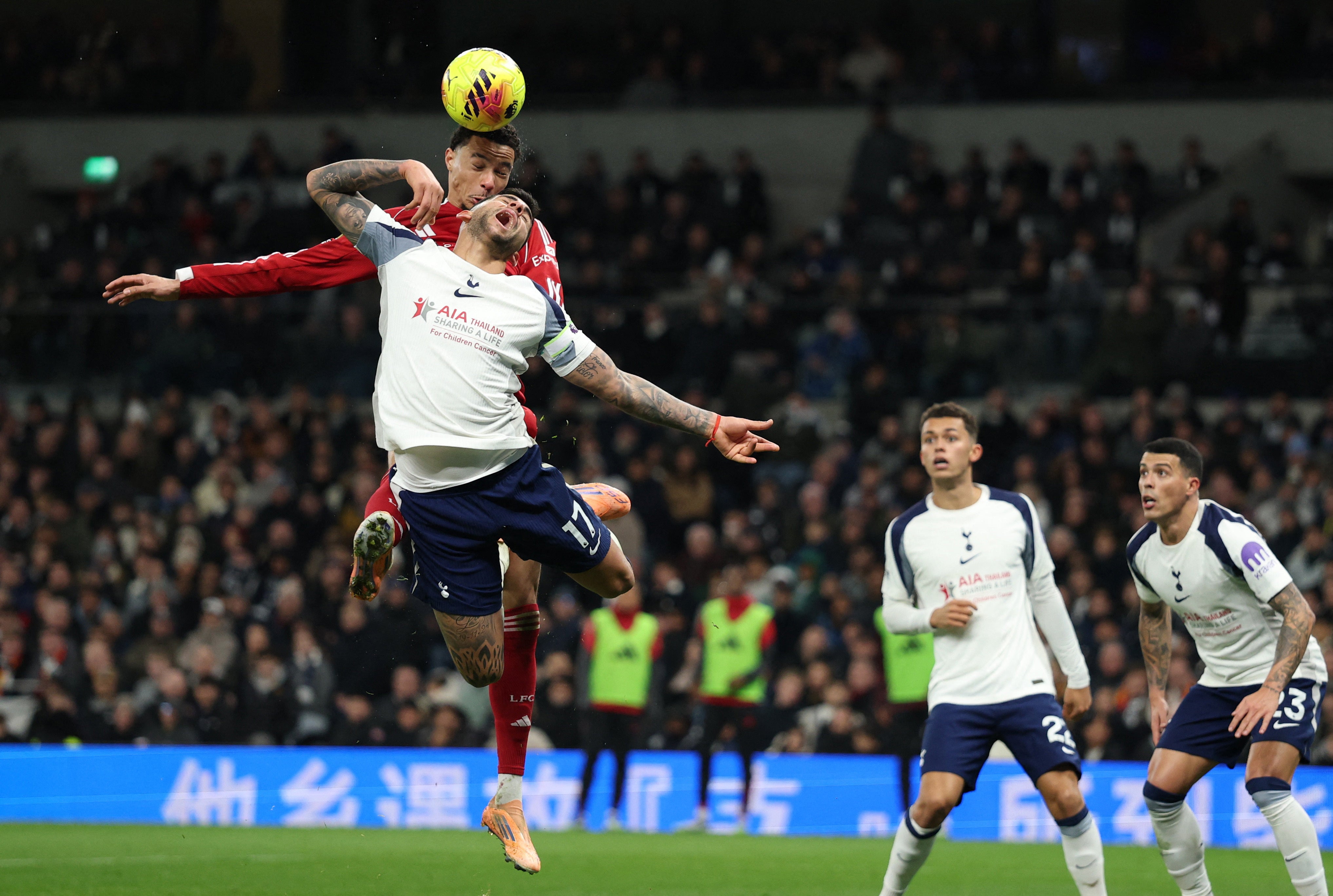Liverpool's Hugo Ekitike beats Tottenham's Cristian Romero to the ball