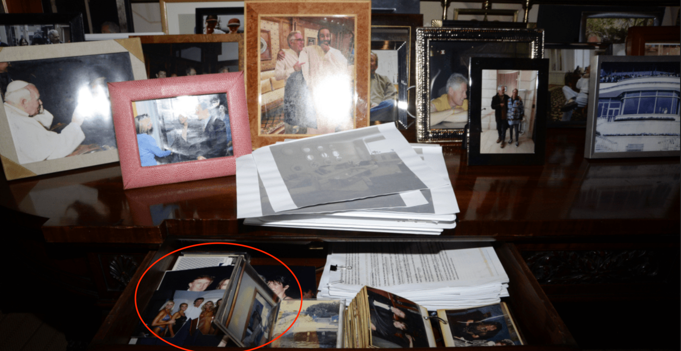<p>A photo of an open desk drawer containing a picture of Donald Trump was taken down from the Department of Justice website over concerns about the women in the images, Deputy Attorney General Todd Blanche said Sunday</p>