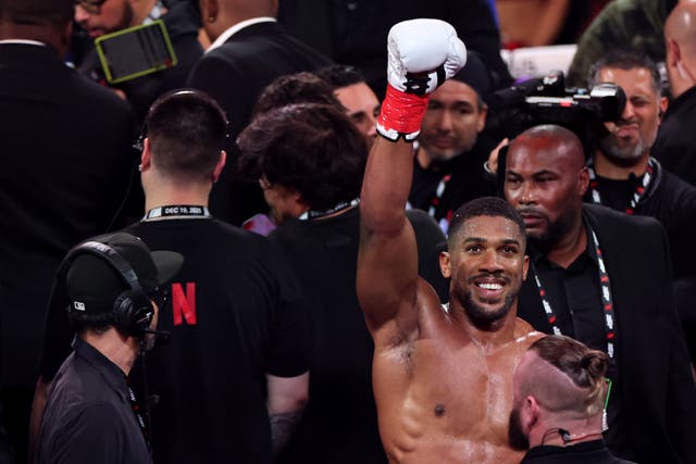 <p>Anthony Joshua celebrates victory over Jake Paul</p>