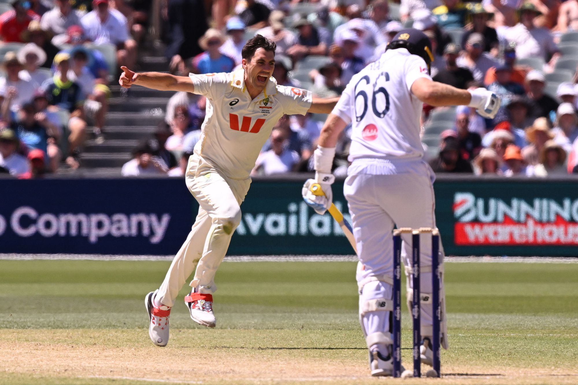 Australia's Pat Cummins celebrates dismissing England's Joe Root