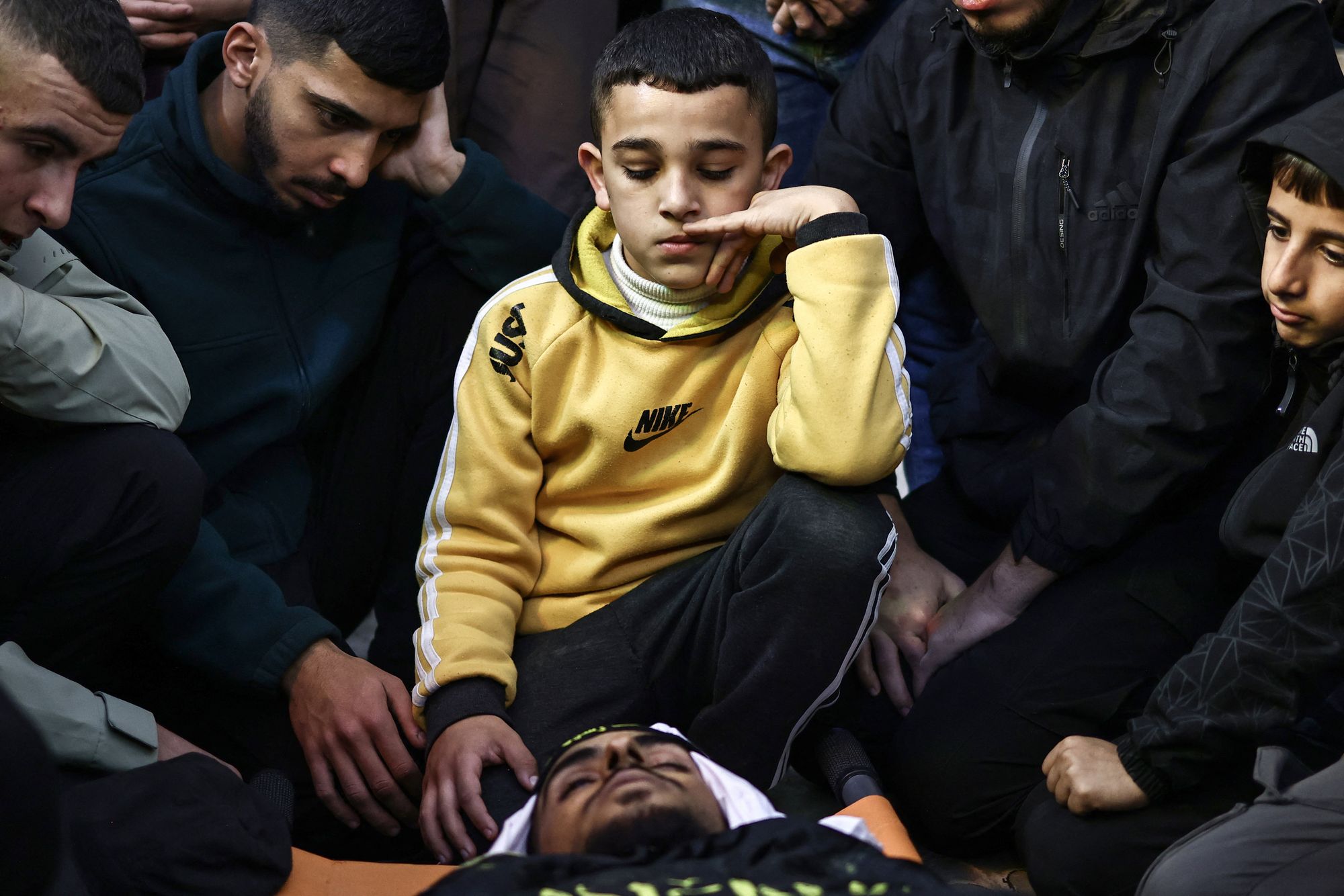 <p>Friends and relatives mourn over the body of Ahmad Zyoud after Israel's military said it killed two Palestinians in the north of the occupied West Bank December 20, 2025, accusing one of throwing ‘a block’ and the other an explosive at its soldiers</p>