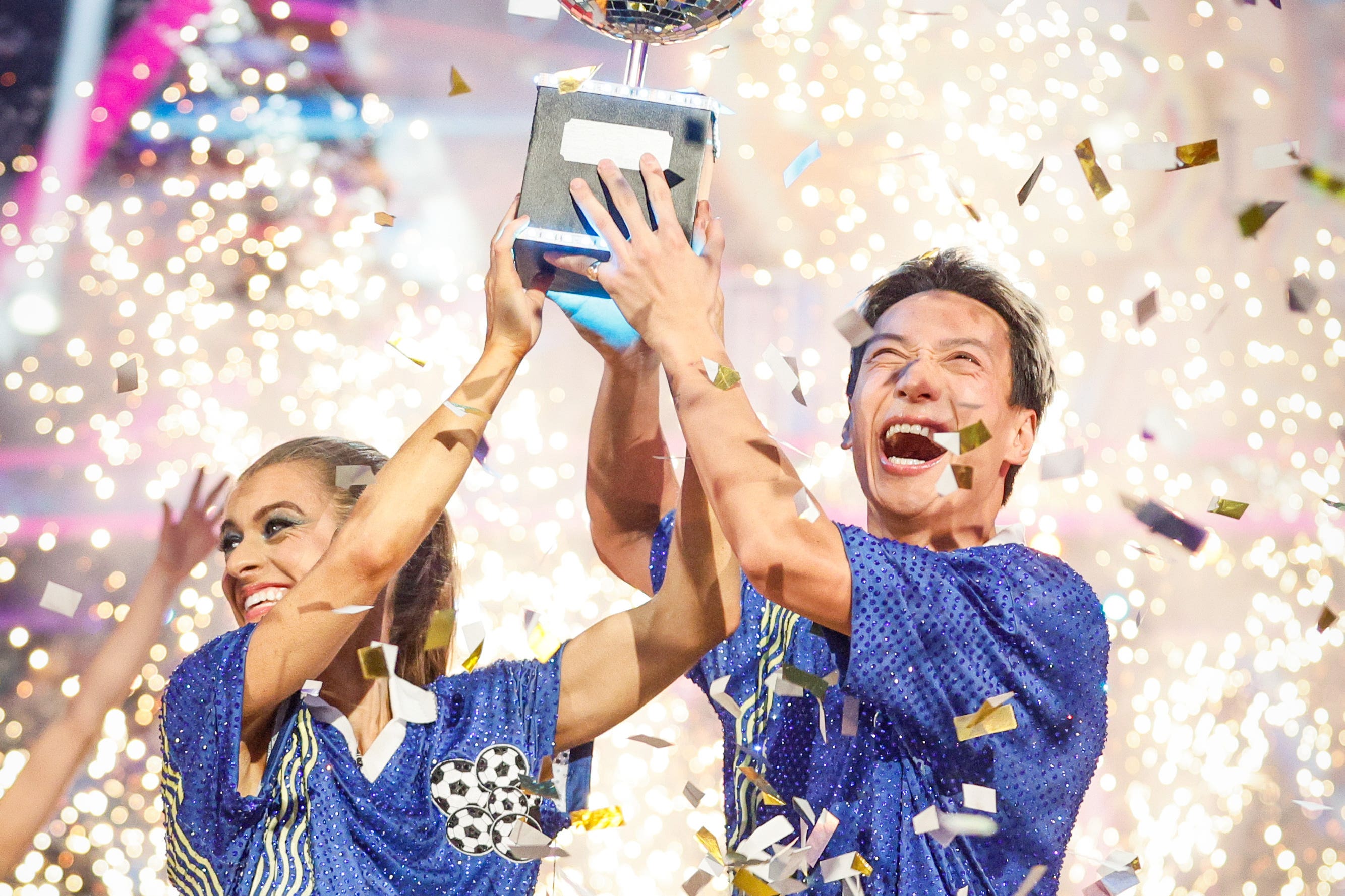 <p>Karen Carney and Carlos Gu with their trophy after winning the 2025 series of Strictly Come Dancing (Guy Levy/BBC)</p>