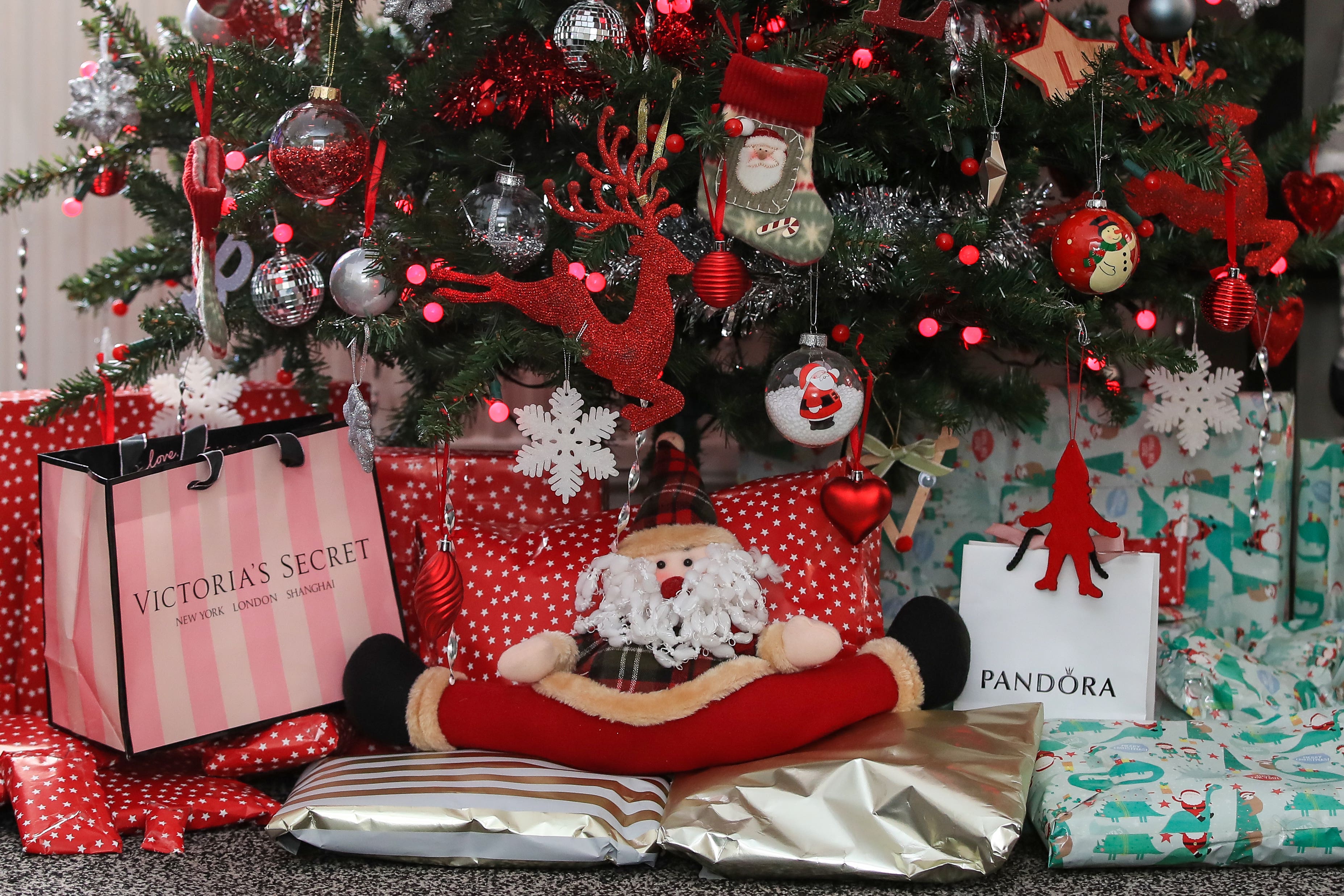 More than half of the public is cutting down on the number of gifts they are buying this Christmas, a poll suggests (Peter Byrne/PA)