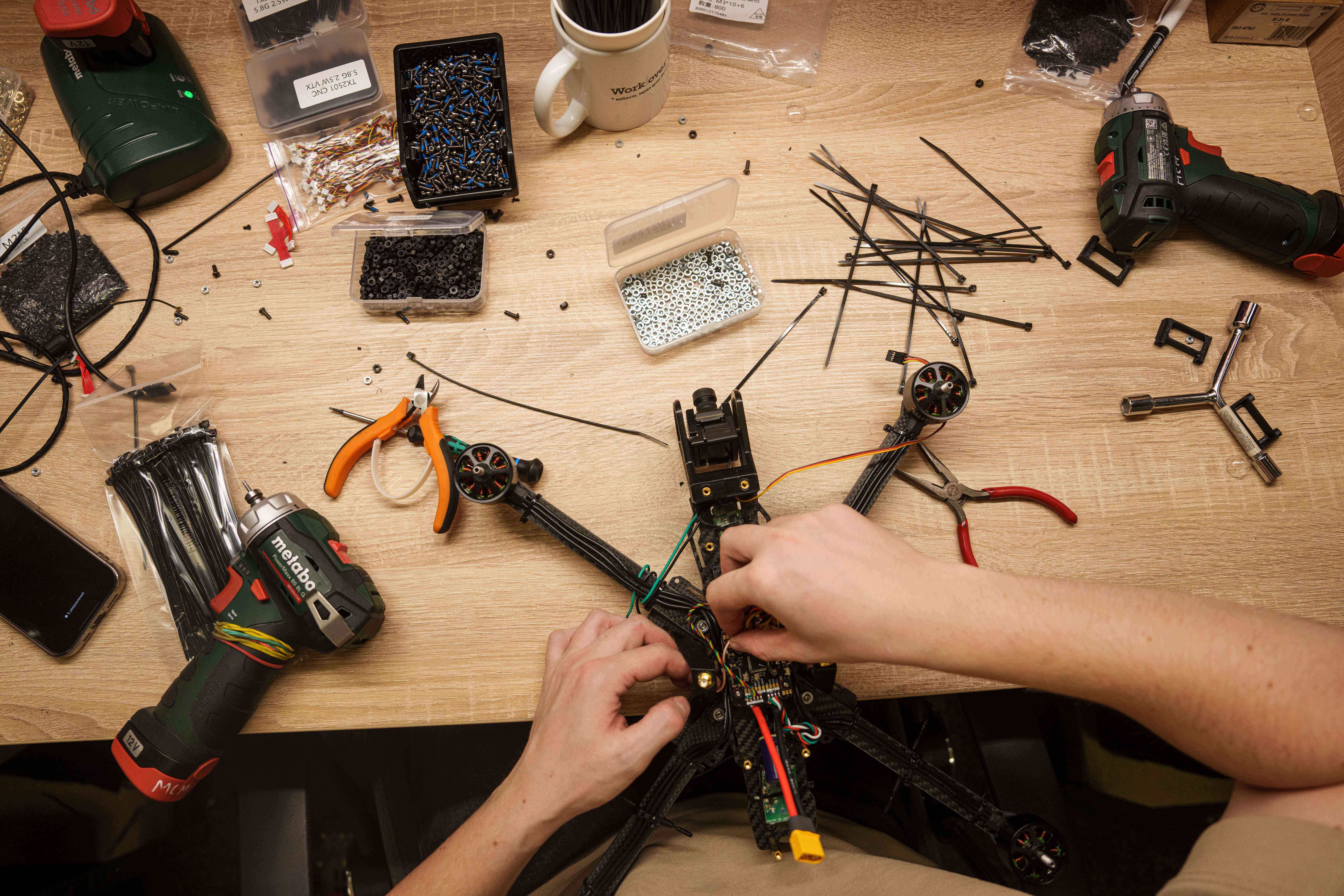 An engineer working on FPV drones