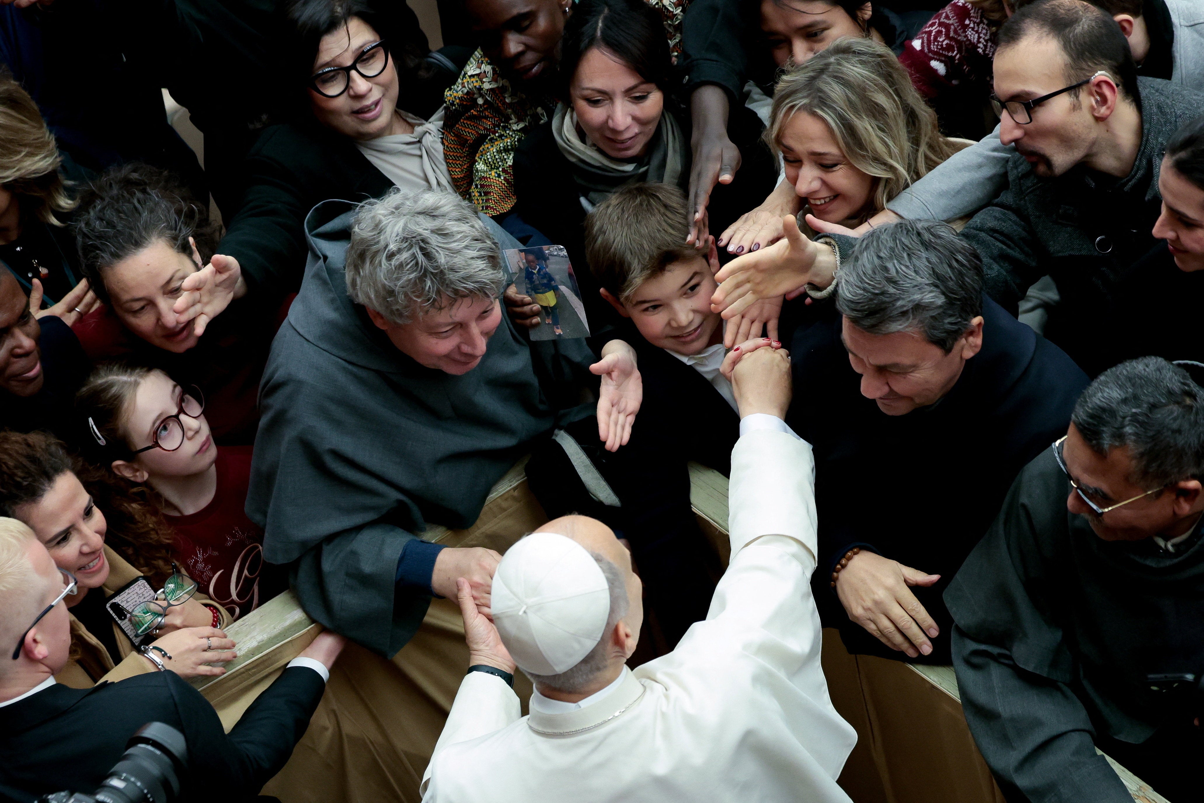 Pope Leo XIV greets the audience at the end of the meeting