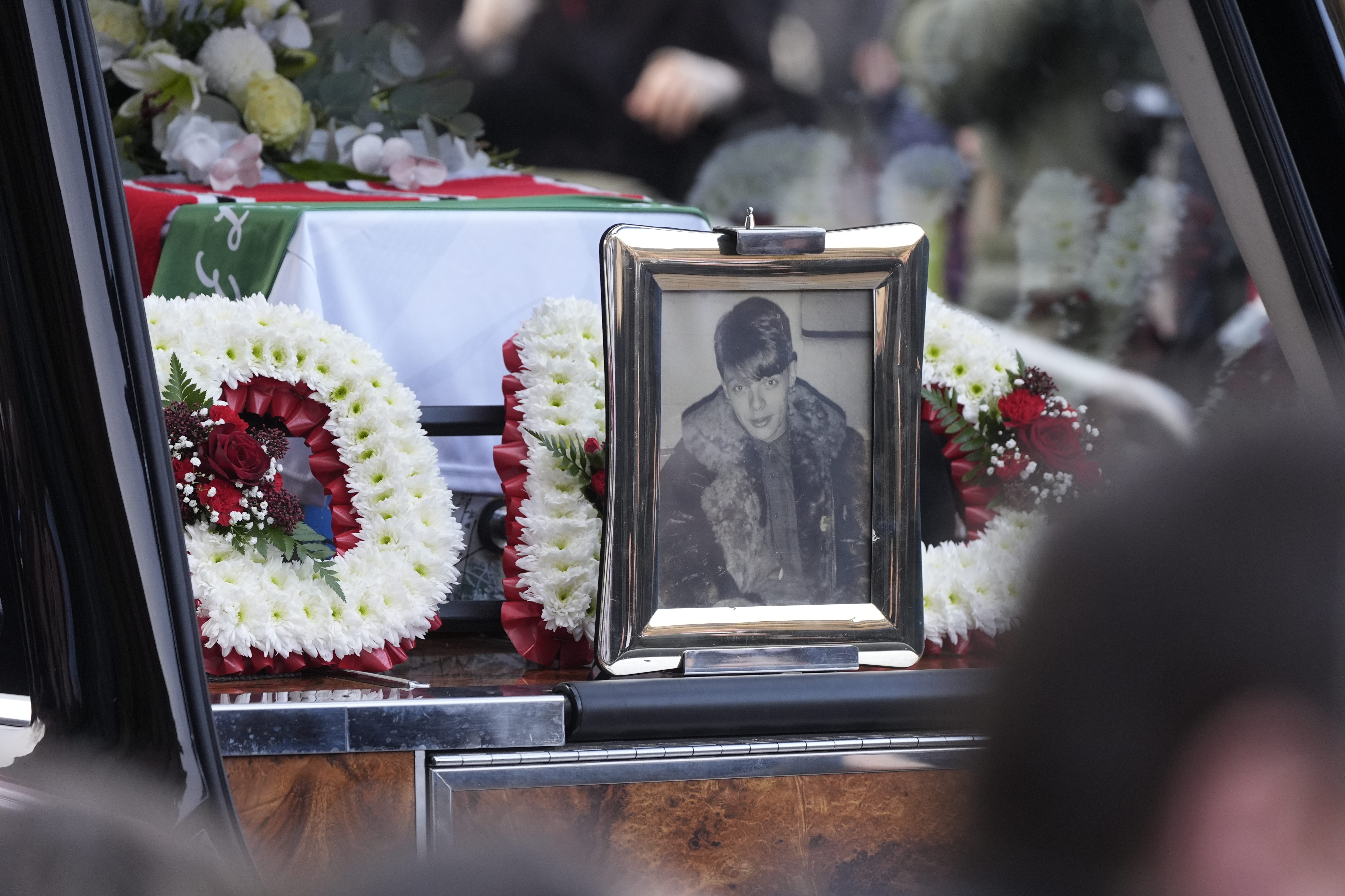 A picture Mani in the hearse following the funeral service of former Stone Roses and Primal Scream bass player Gary Mounfield (Peter Byrne/PA)