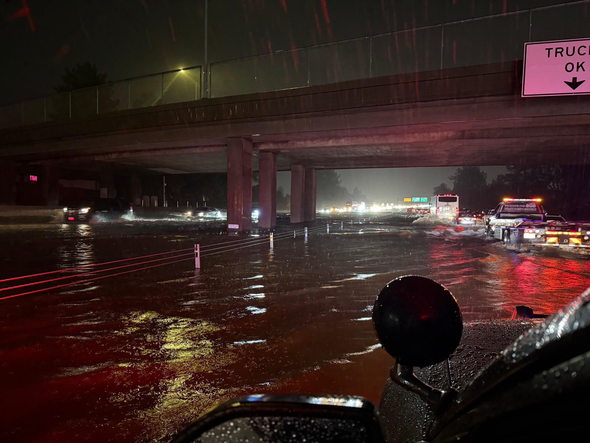 A flooded overpass is seen at night in California's Shasta County