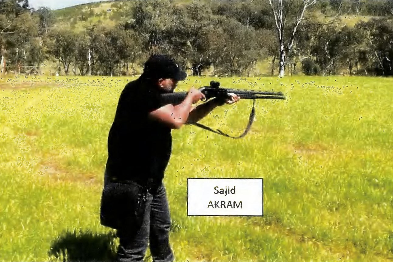 This handout photo from a court exhibit released by the NSW Courts as part of the police facts sheet on December 22, 2025 shows a frame grab taken from a video recorded in late October 2025 of Sajid Akram allegedly firing a shotgun and moving in a tactical manner in a countryside location, suspected to be in New South Wales