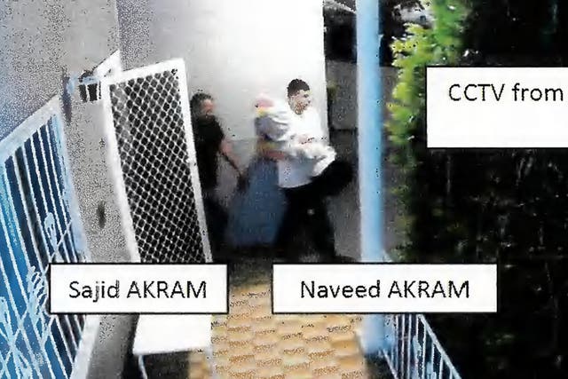 <p>CCTV footage of Sajid and Naveed Akram allegedly exiting 103 Brighton Avenue in Campsie on December 14 2025 as they carried items wrapped in blankets</p>
