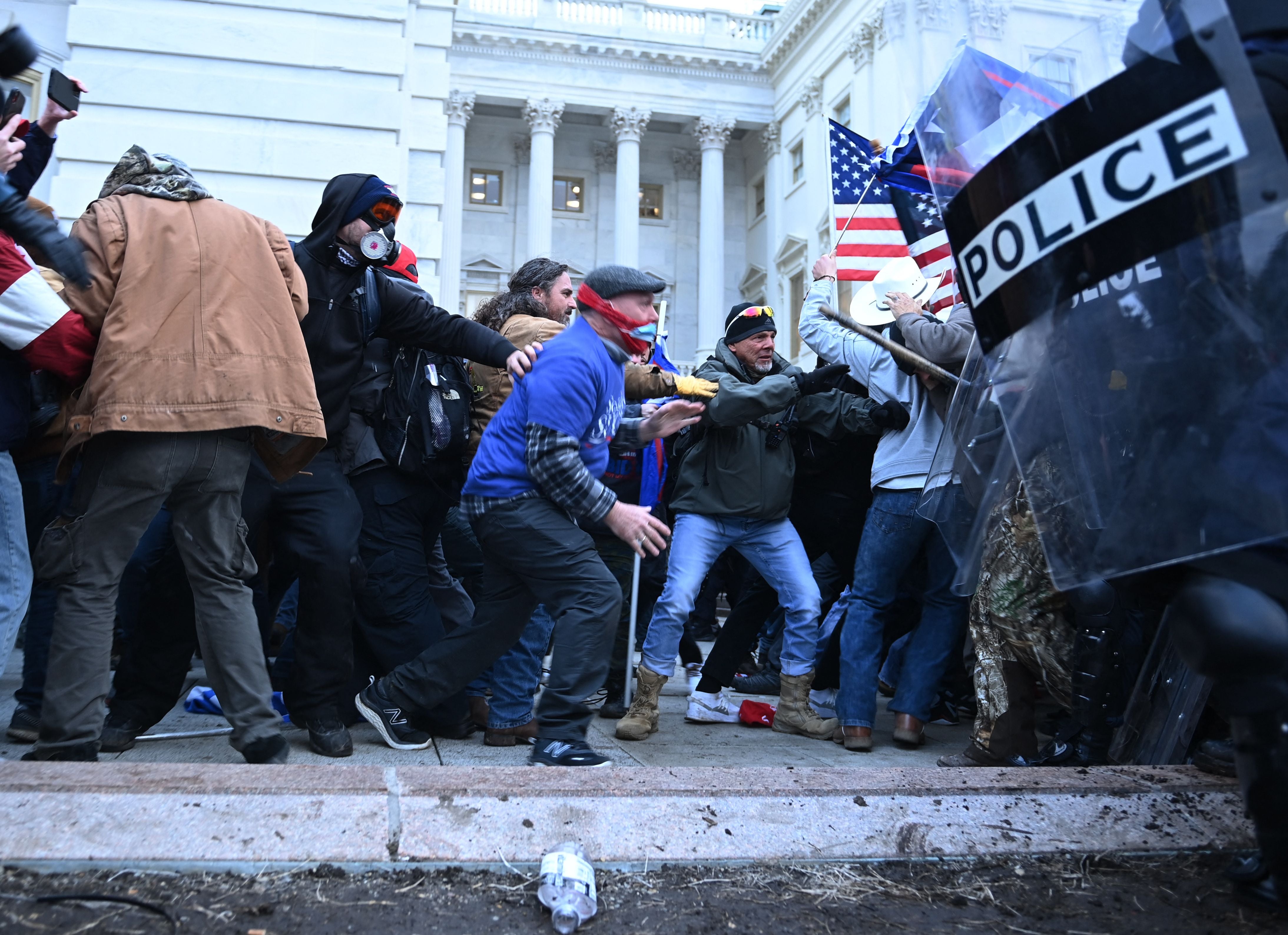 <p>Trump supporters clash with police and security forces, as they storm the US Capitol in Washington, DC, on January 6, 2021</p>